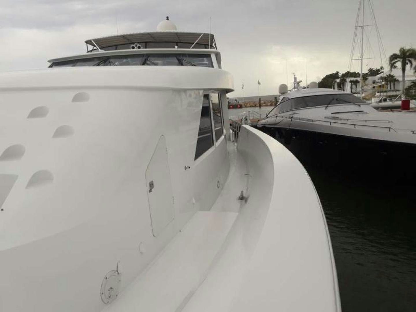 a white boat with black spots aboard TRUE NORTH Yacht for Sale