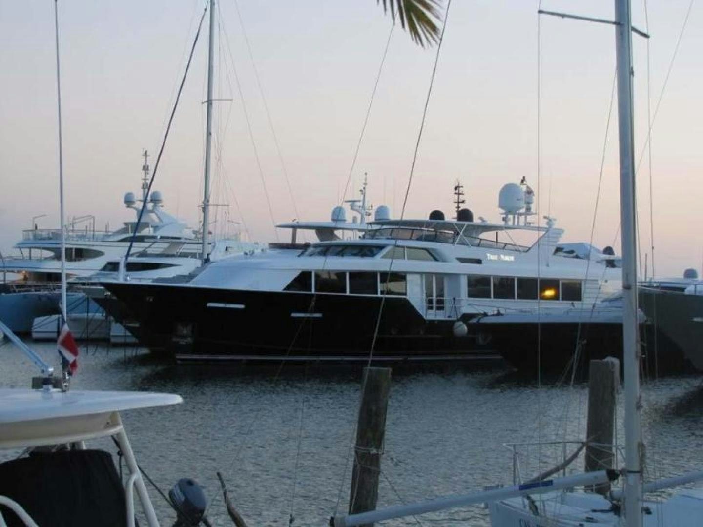a boat docked at a pier aboard TRUE NORTH Yacht for Sale