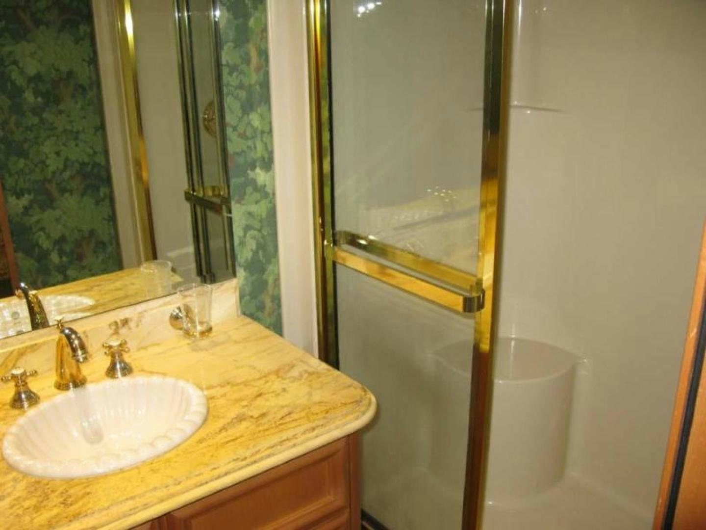 a bathroom with a sink and a mirror aboard TRUE NORTH Yacht for Sale