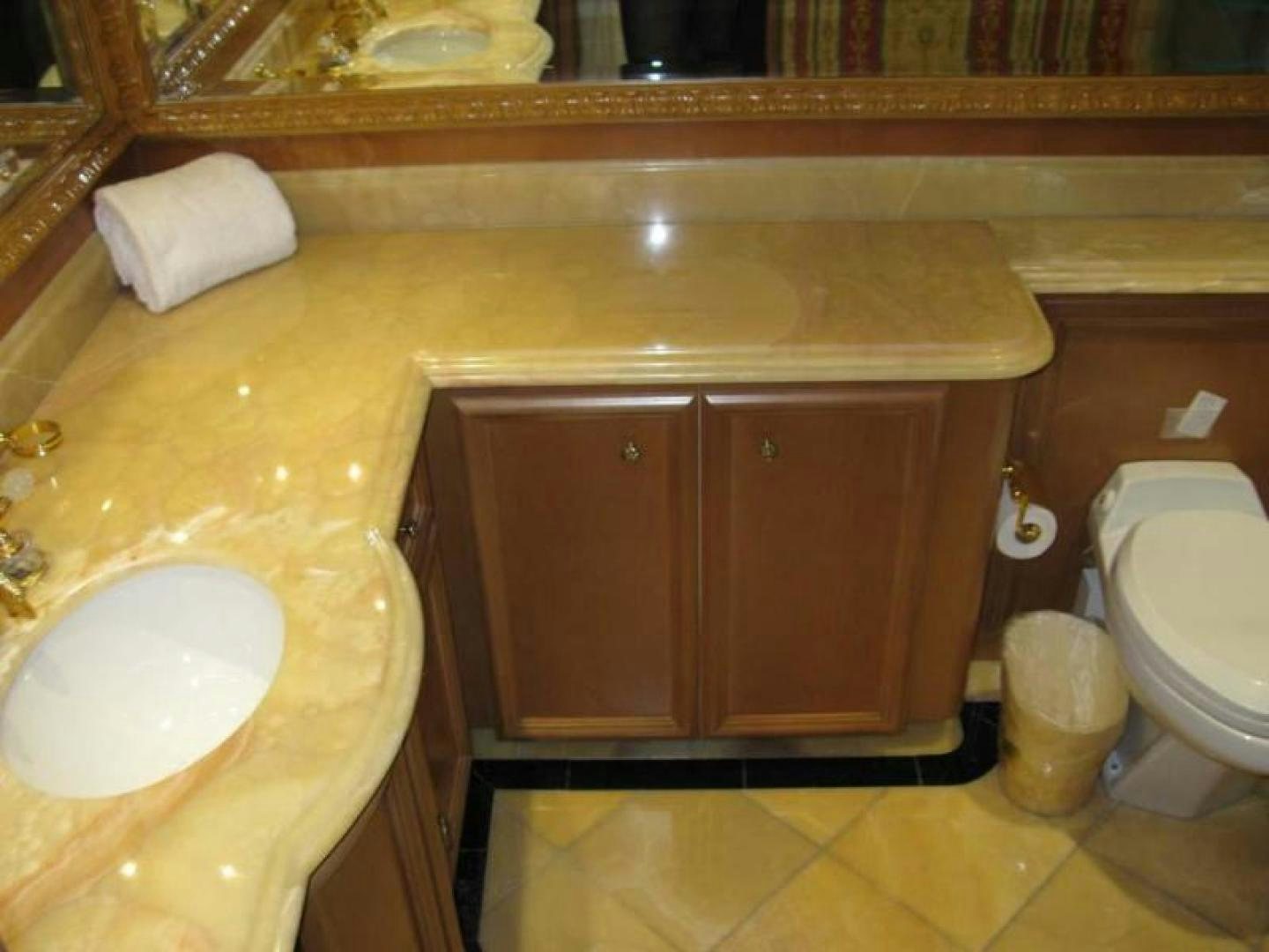a bathroom with a sink and toilet aboard TRUE NORTH Yacht for Sale