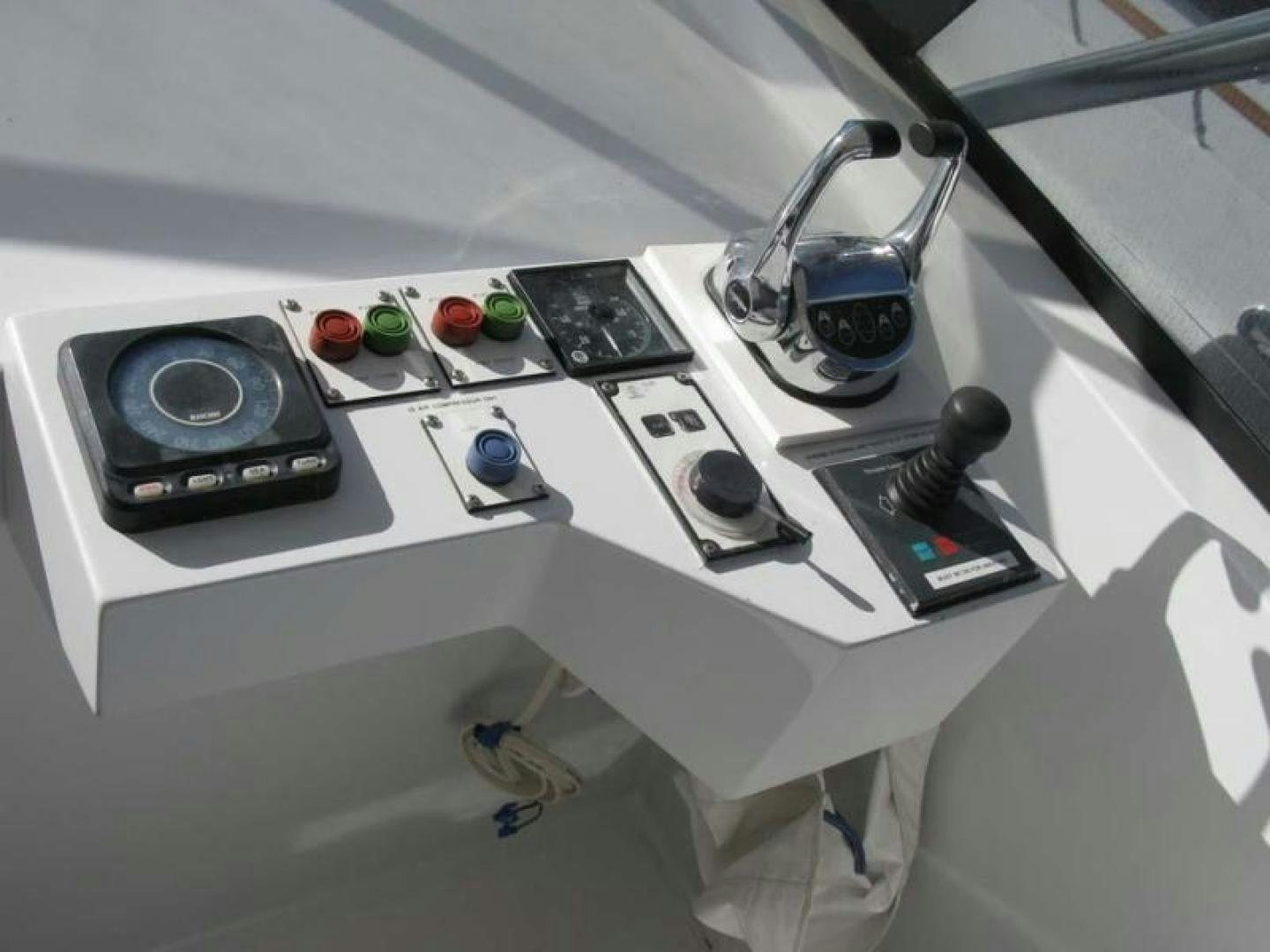 a white machine with a black and silver knobs and a black coffee maker aboard TRUE NORTH Yacht for Sale