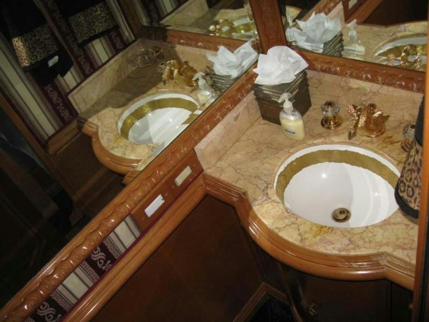 a bathroom with a sink and a mirror aboard TRUE NORTH Yacht for Sale