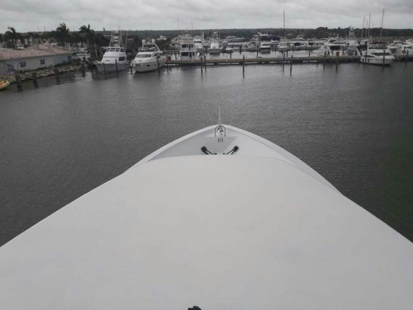 a large white umbrella sits on a dock aboard TRUE NORTH Yacht for Sale