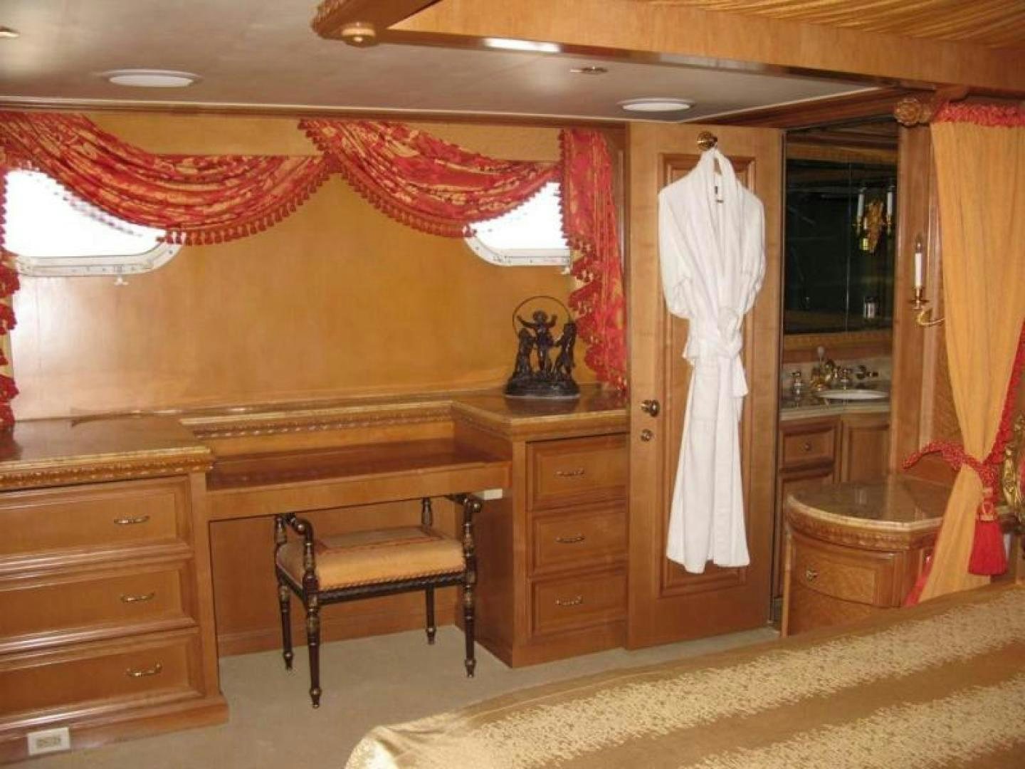 a room with a chair and a dresser and a bed aboard TRUE NORTH Yacht for Sale