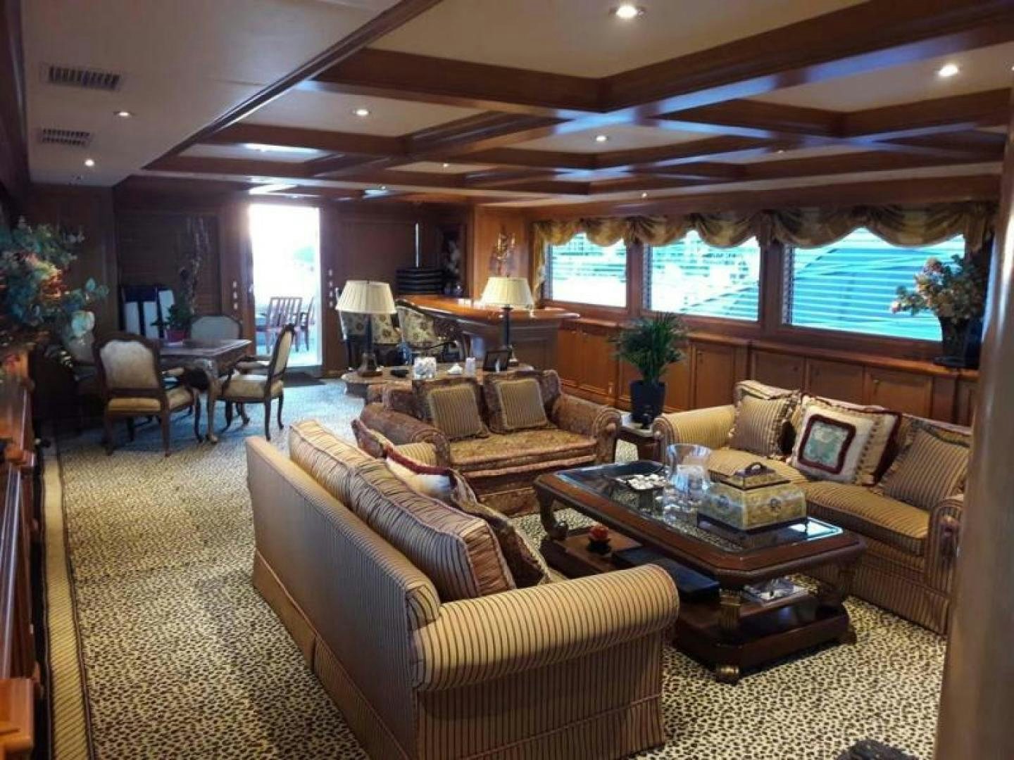 a living room with a couch and a coffee table aboard TRUE NORTH Yacht for Sale