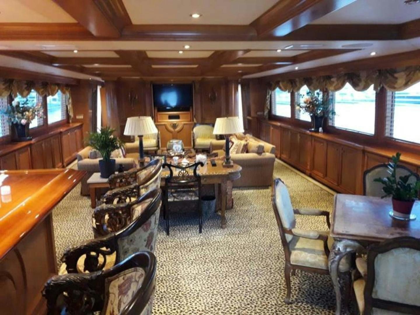 a large living room with a large window aboard TRUE NORTH Yacht for Sale