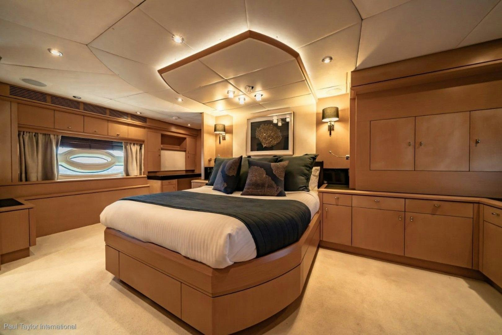 a room with a bed and a large window aboard SOPHIA Yacht for Sale