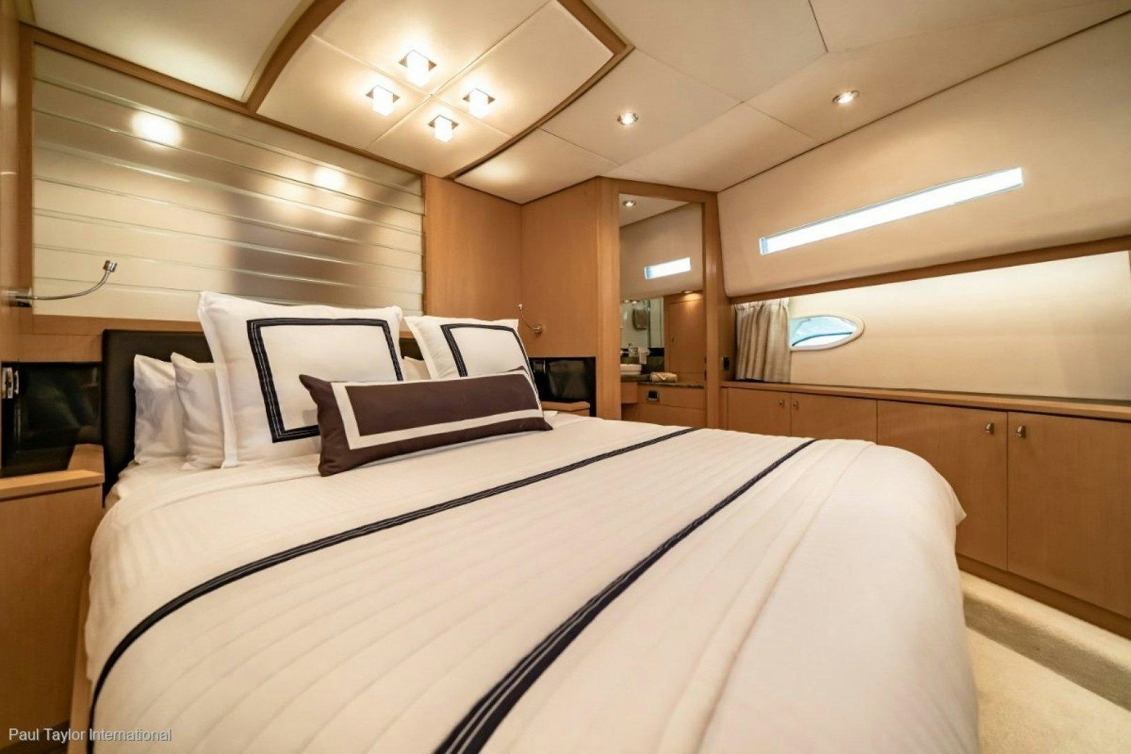 a bed with white sheets aboard SOPHIA Yacht for Sale