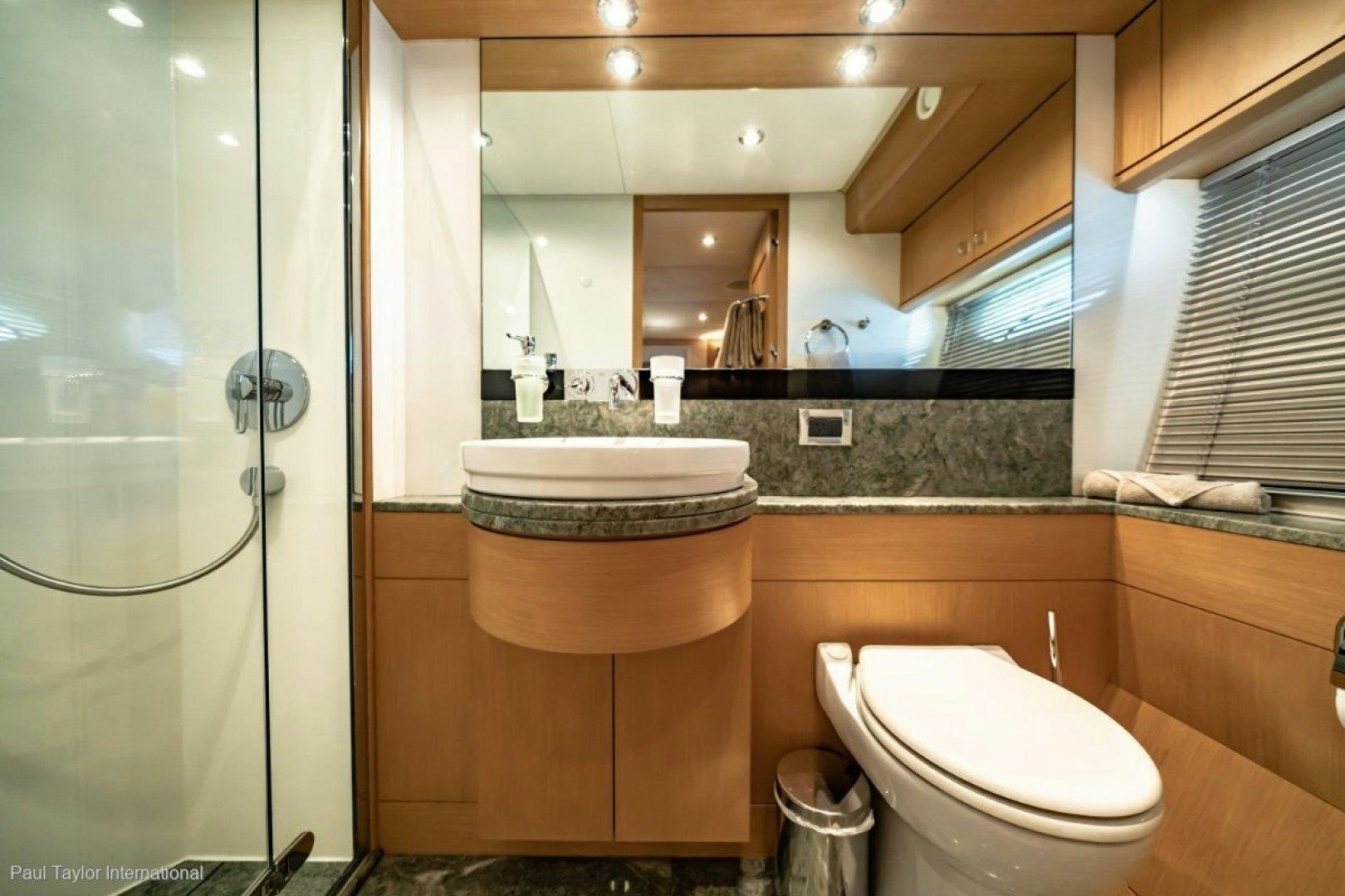 a bathroom with a large mirror aboard SOPHIA Yacht for Sale