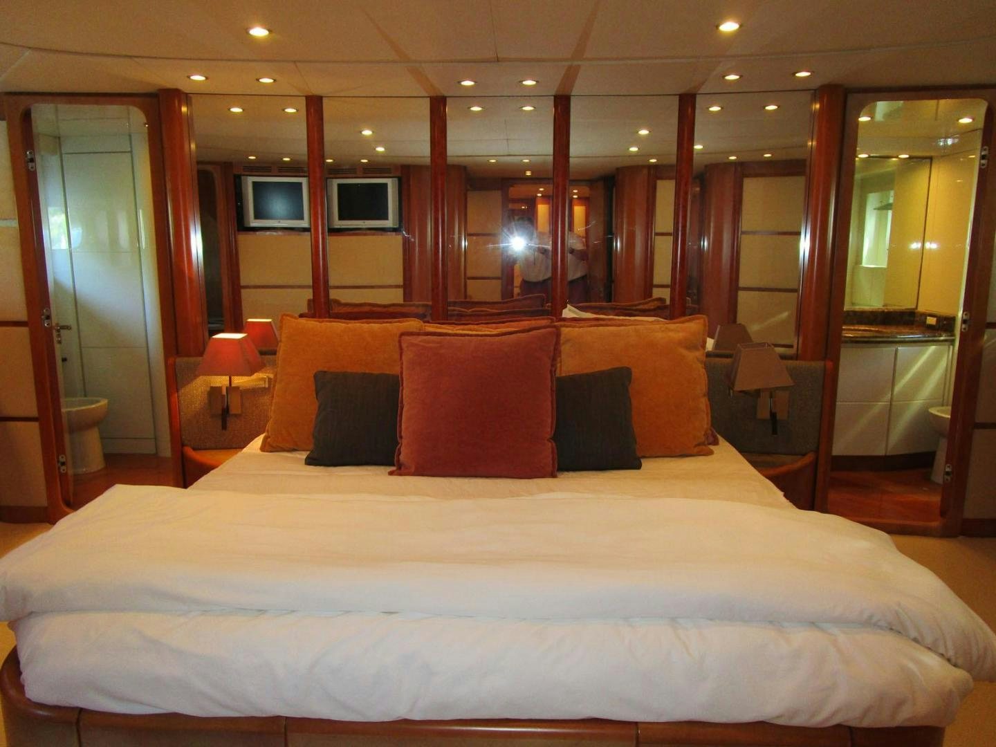 a bed with pillows on it aboard DEAR HENRI Yacht for Sale