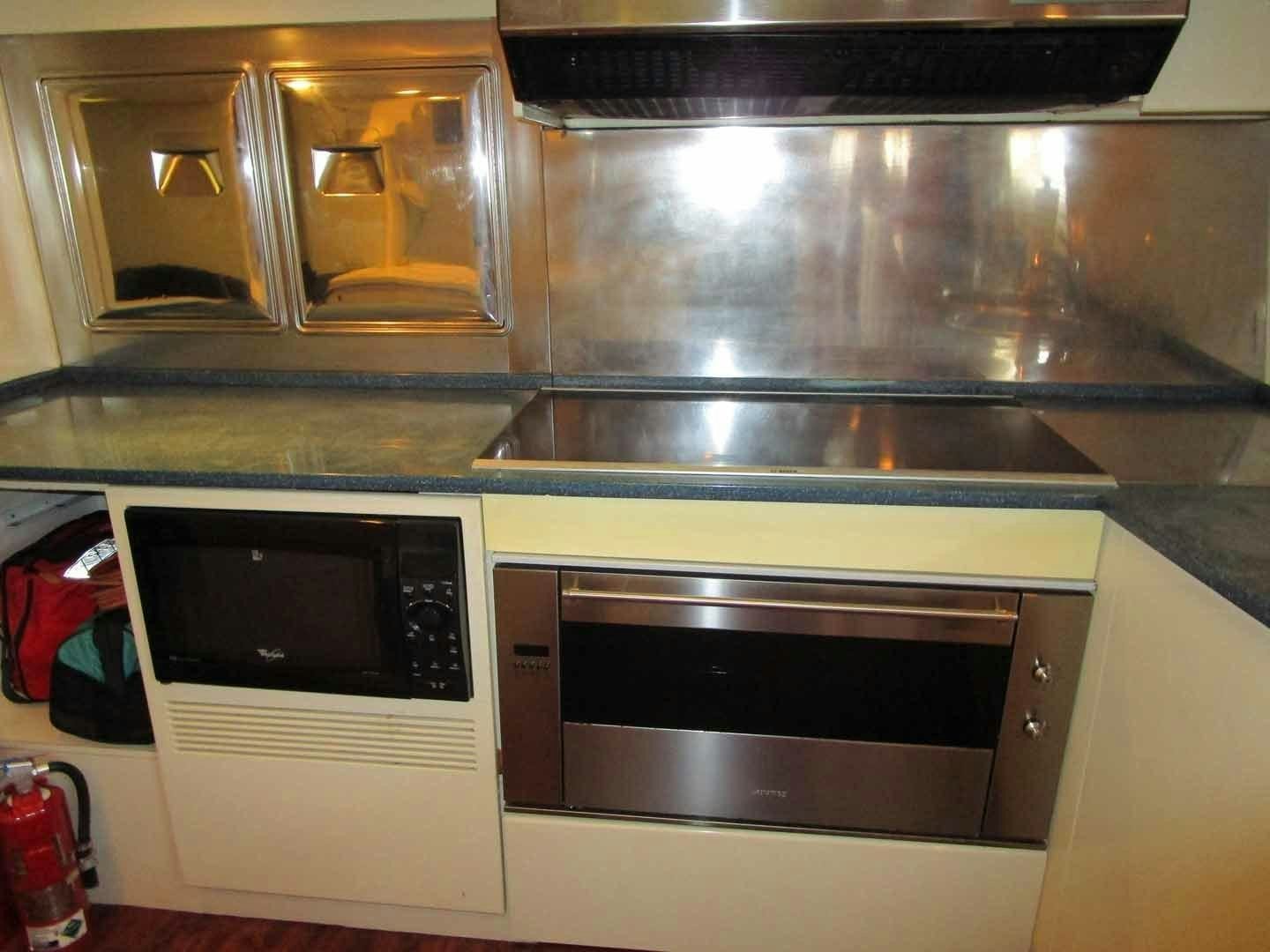 a kitchen with two microwave ovens aboard DEAR HENRI Yacht for Sale
