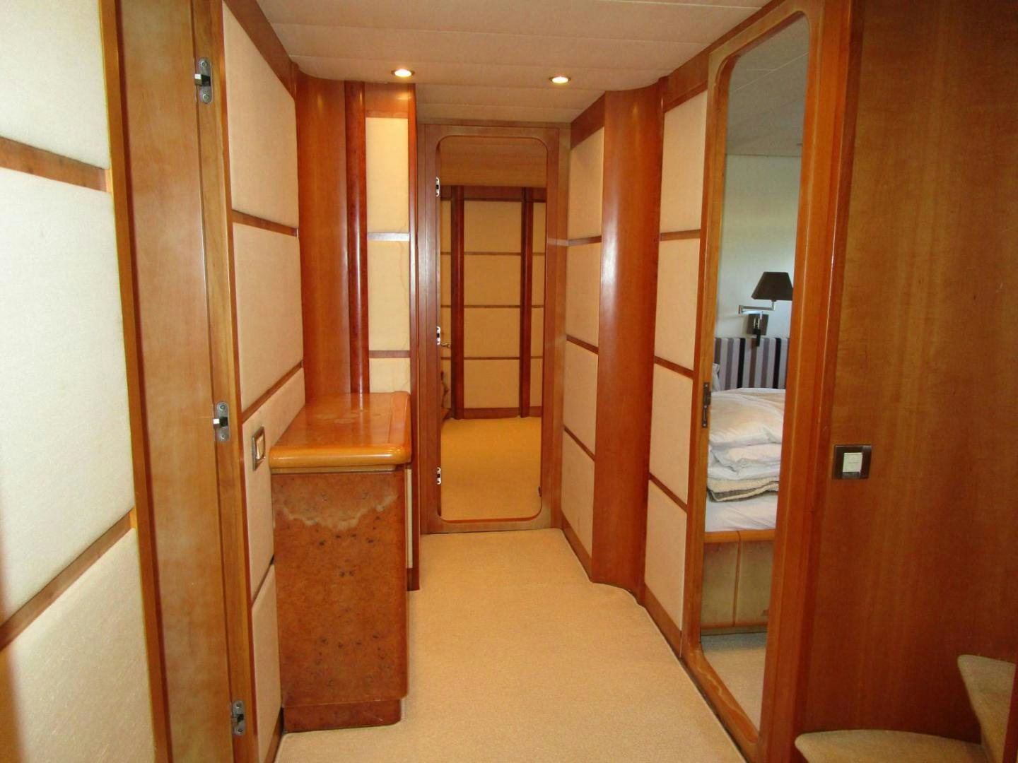 a room with a closet and a bed aboard DEAR HENRI Yacht for Sale