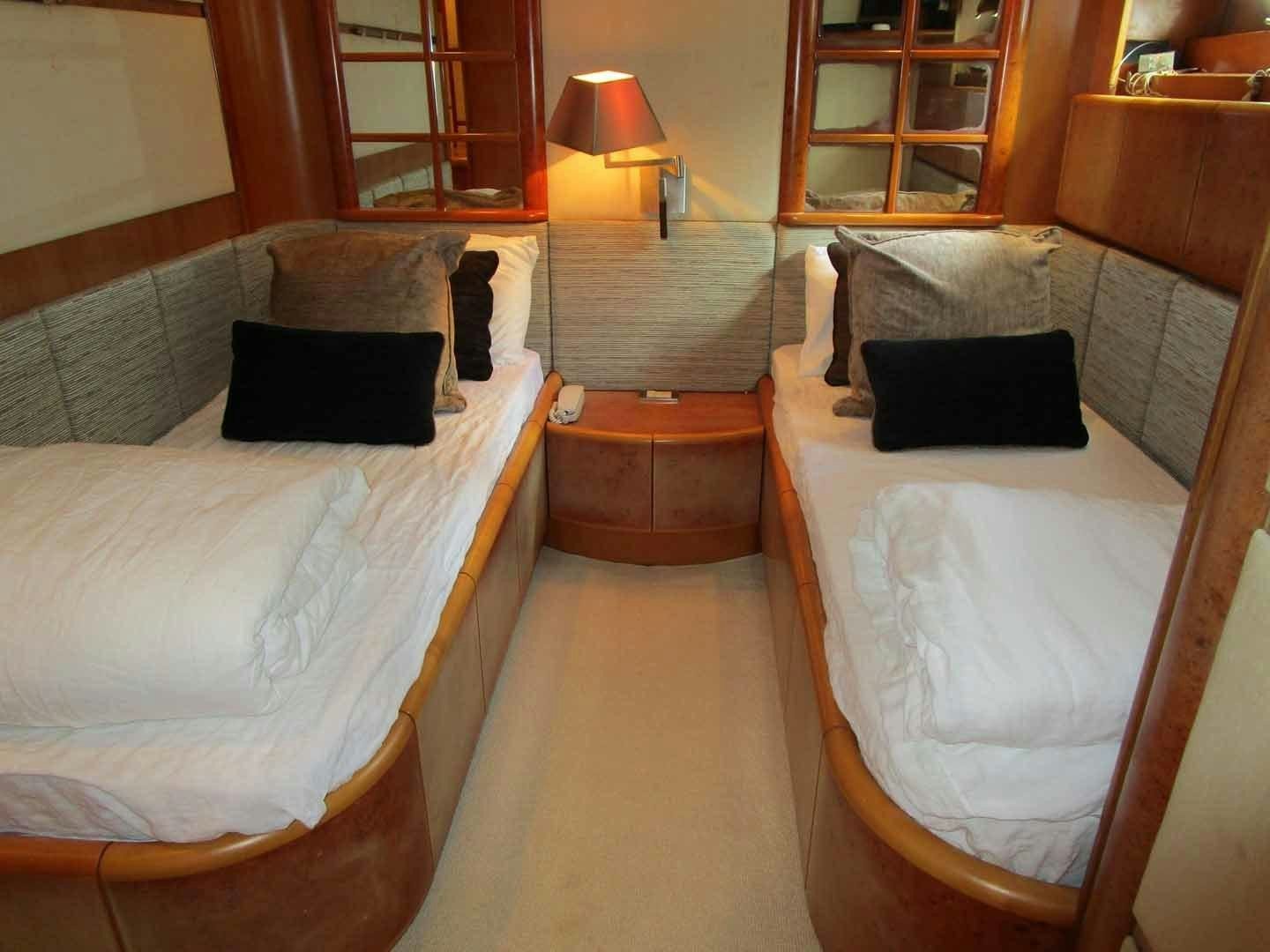 a room with two beds aboard DEAR HENRI Yacht for Sale