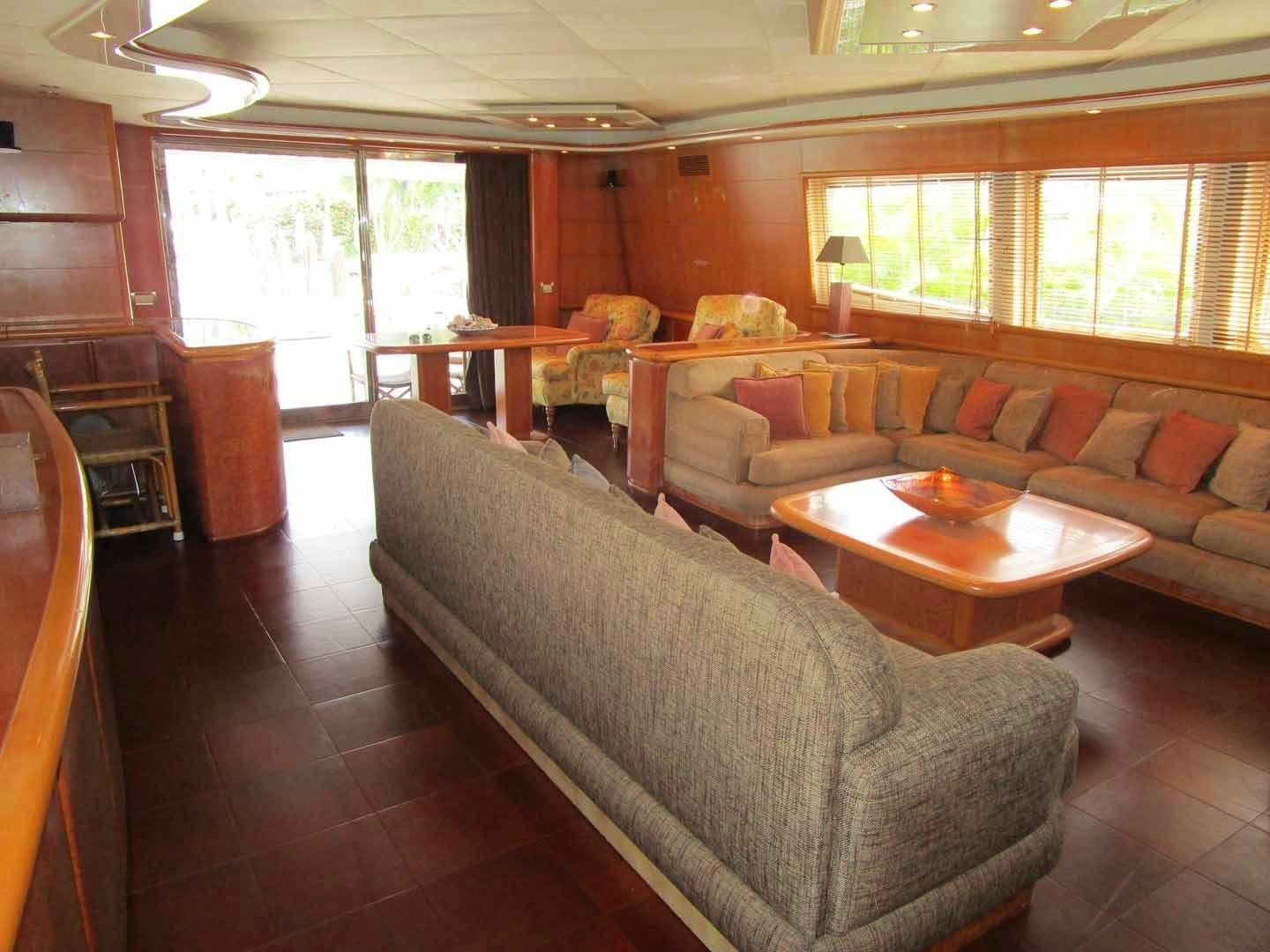 a living room with a wood floor aboard DEAR HENRI Yacht for Sale
