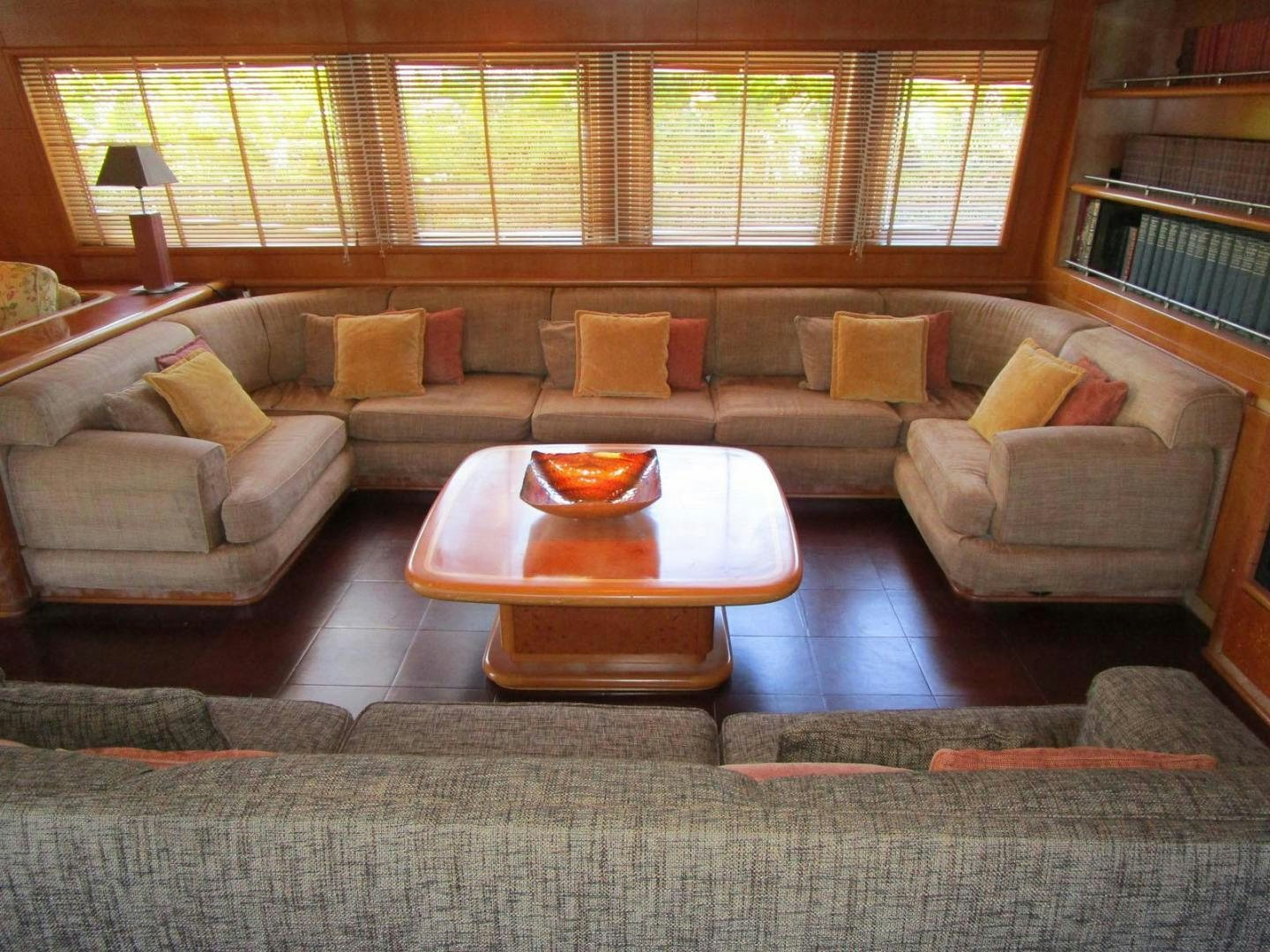 a living room with a couch and a coffee table aboard DEAR HENRI Yacht for Sale