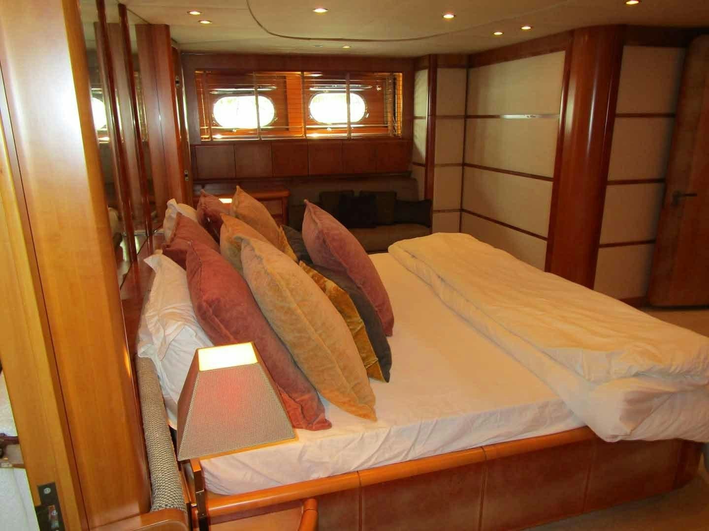 a bed with a white sheet aboard DEAR HENRI Yacht for Sale