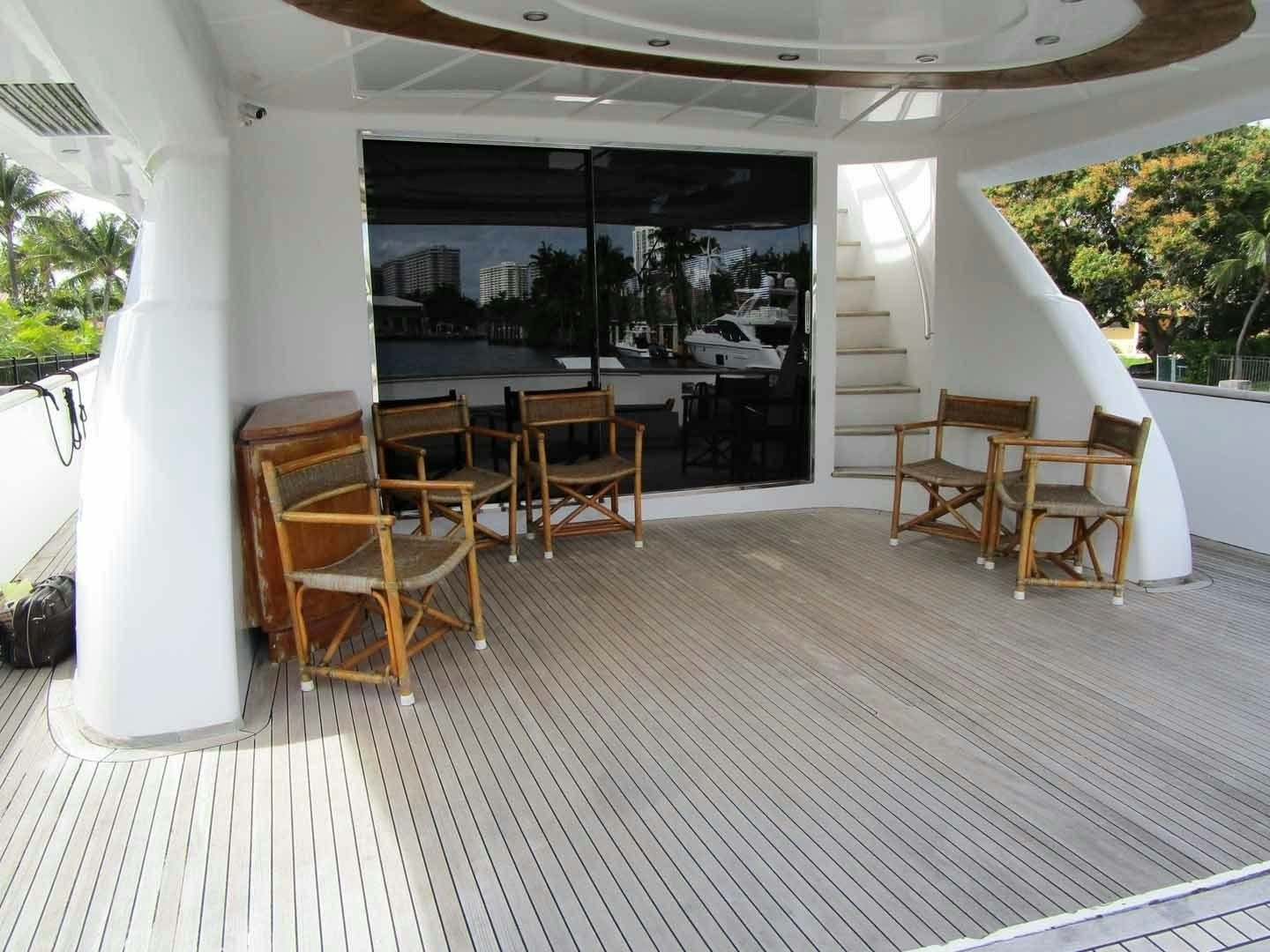 a room with chairs and tables aboard DEAR HENRI Yacht for Sale