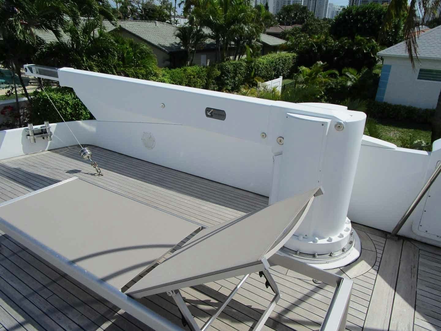 a white boat on a deck aboard DEAR HENRI Yacht for Sale