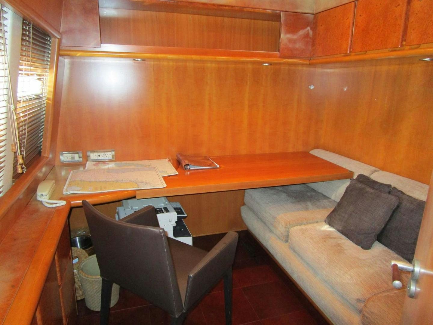 a room with a couch and a table aboard DEAR HENRI Yacht for Sale