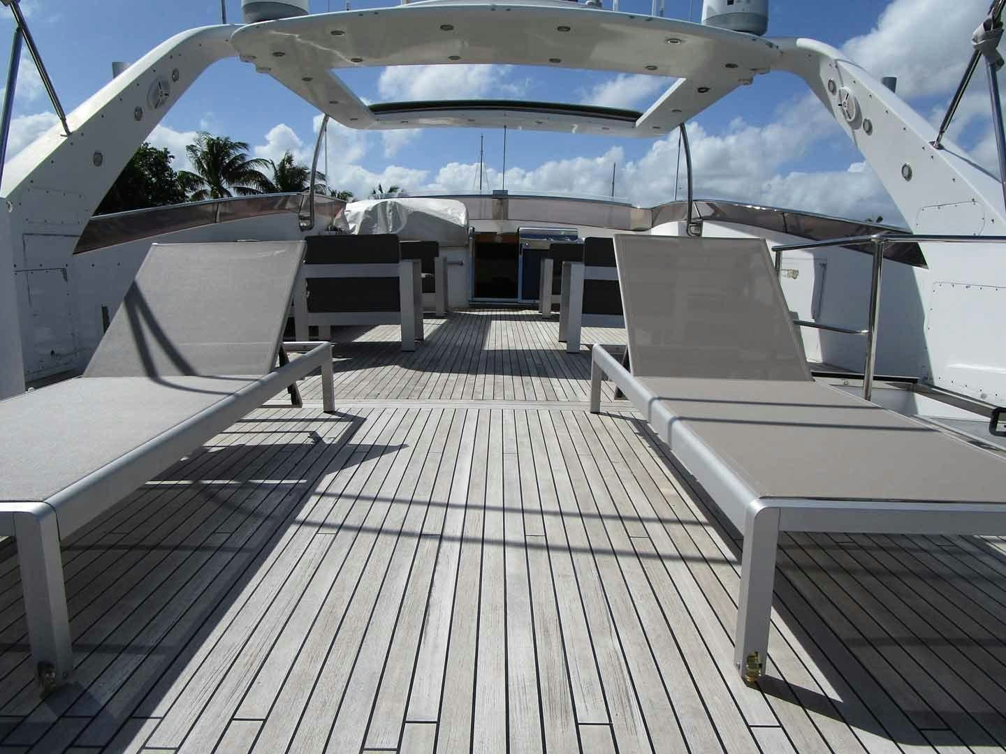 a deck with a large white tent and a pool aboard DEAR HENRI Yacht for Sale