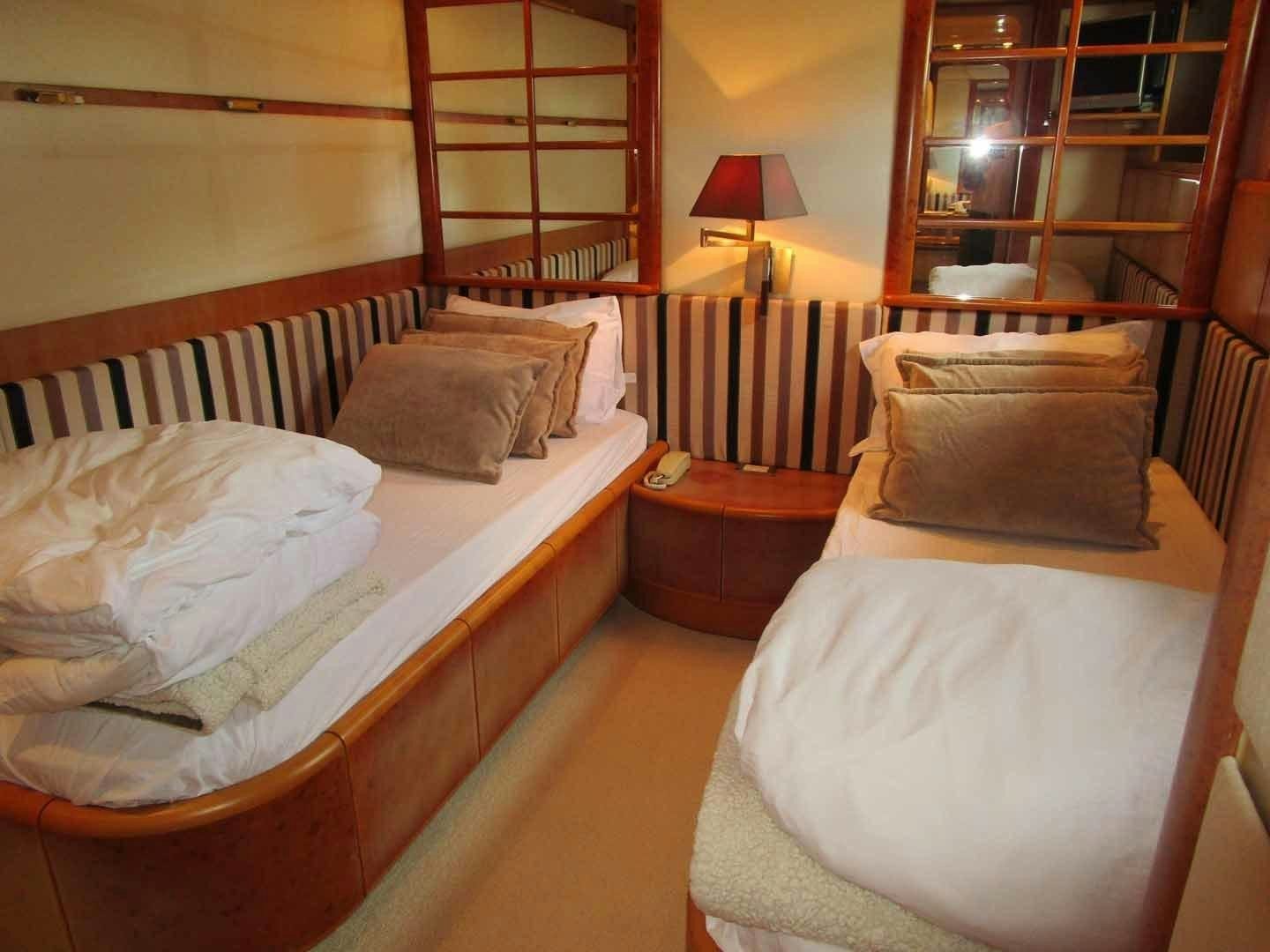 a couple of beds in a room aboard DEAR HENRI Yacht for Sale