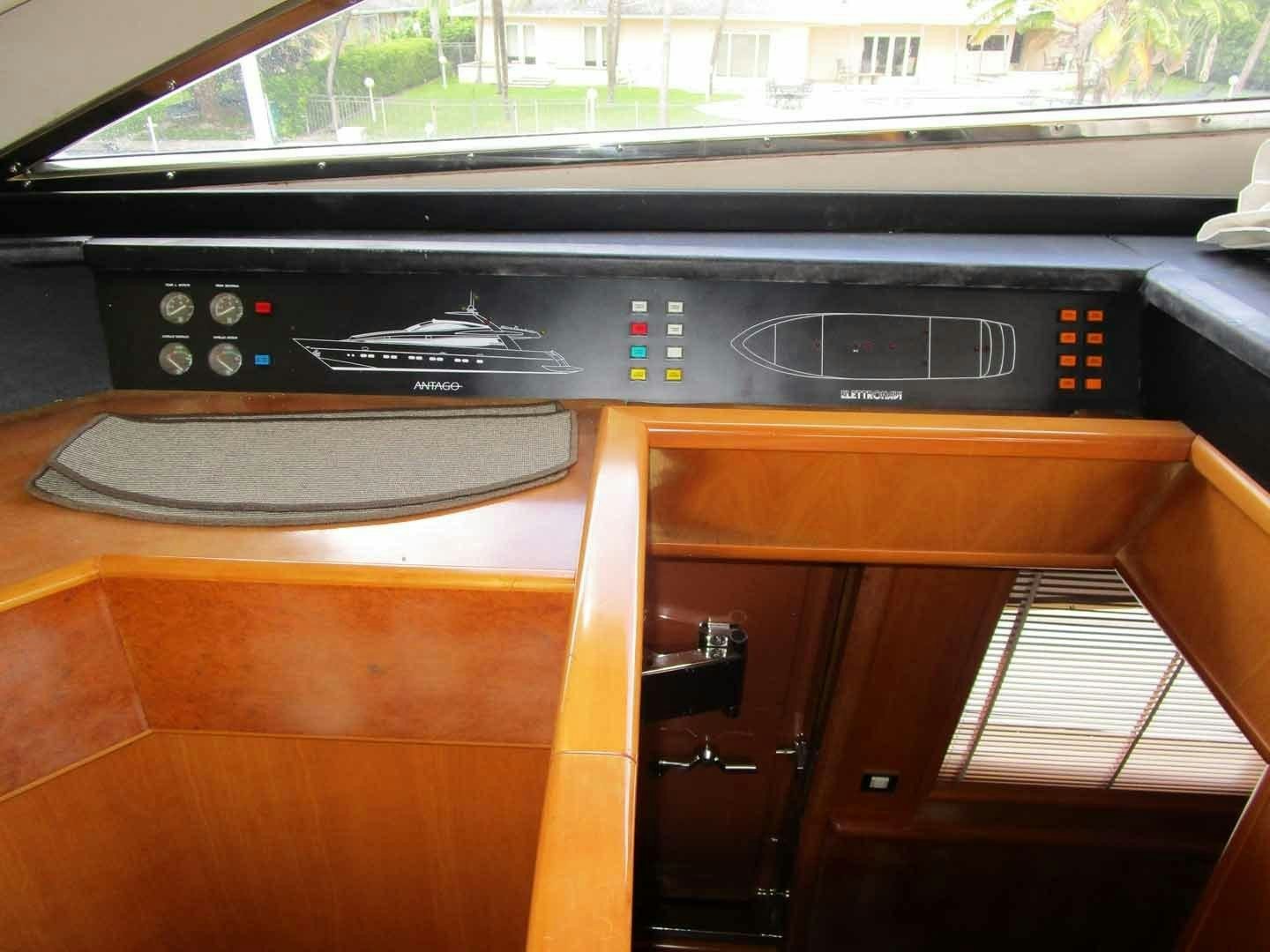 a black radio on a wooden table aboard DEAR HENRI Yacht for Sale
