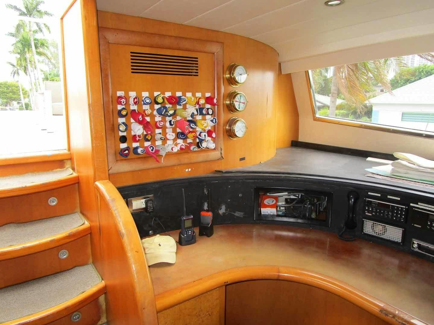 a room with a table and a window aboard DEAR HENRI Yacht for Sale