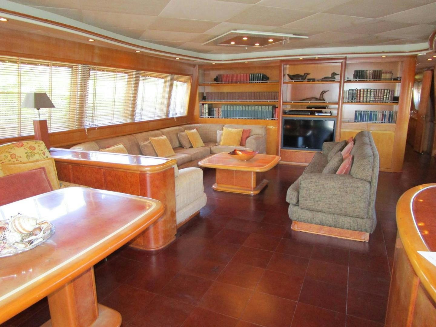 a living room with a fireplace aboard DEAR HENRI Yacht for Sale