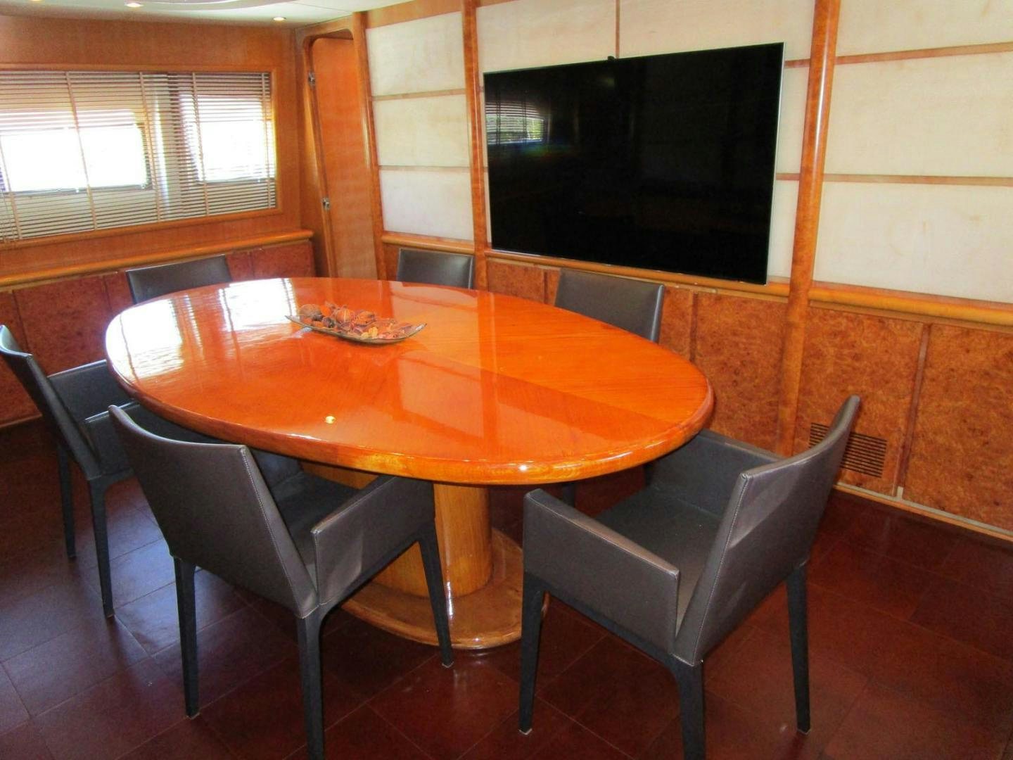 a table and chairs in a room aboard DEAR HENRI Yacht for Sale