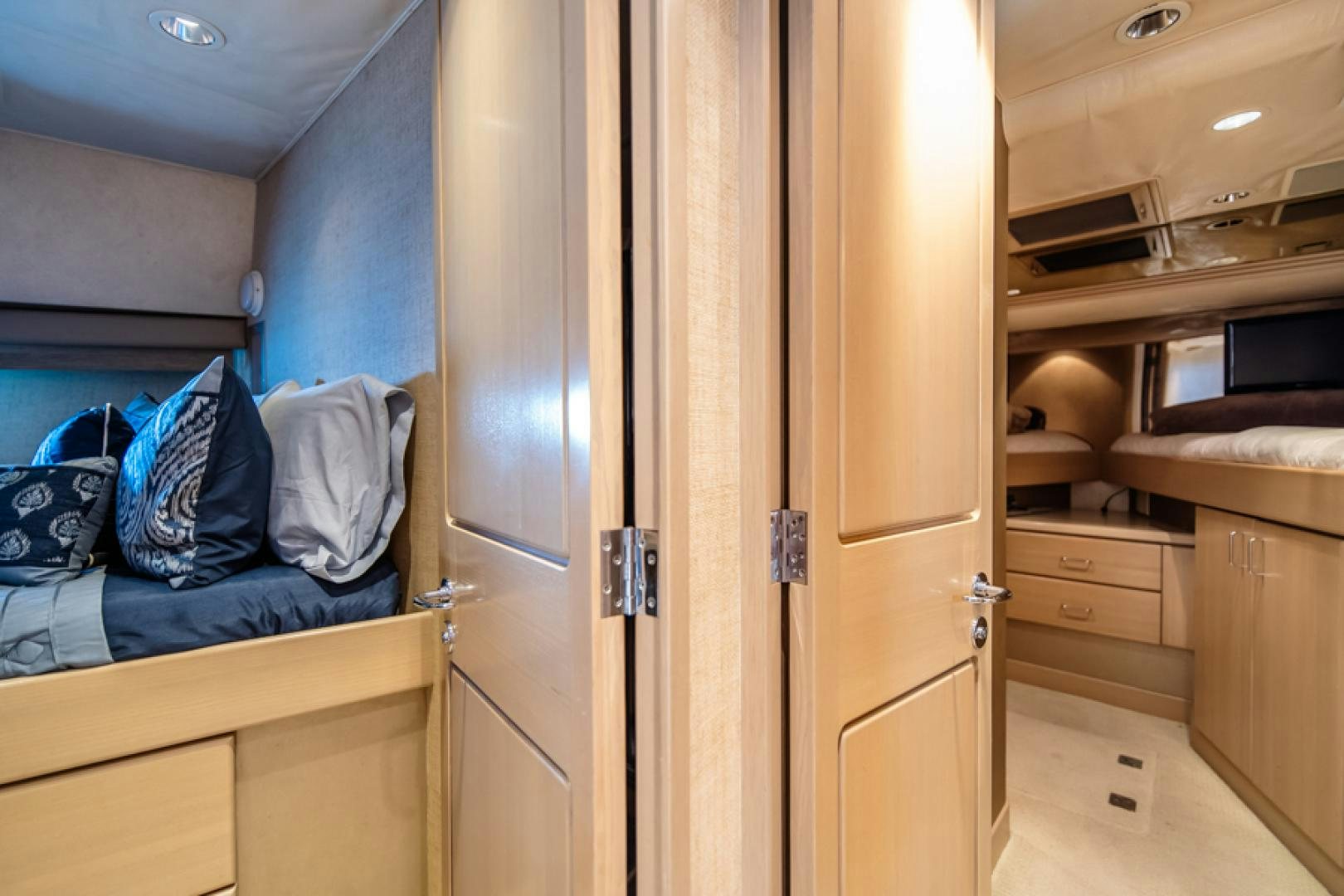 a room with a closet and a bed aboard NO EXCEPTIONS Yacht for Sale