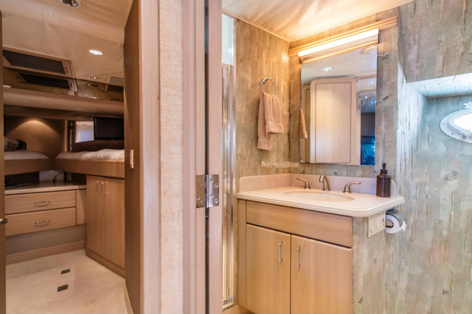 a bathroom with a sink and a mirror aboard NO EXCEPTIONS Yacht for Sale