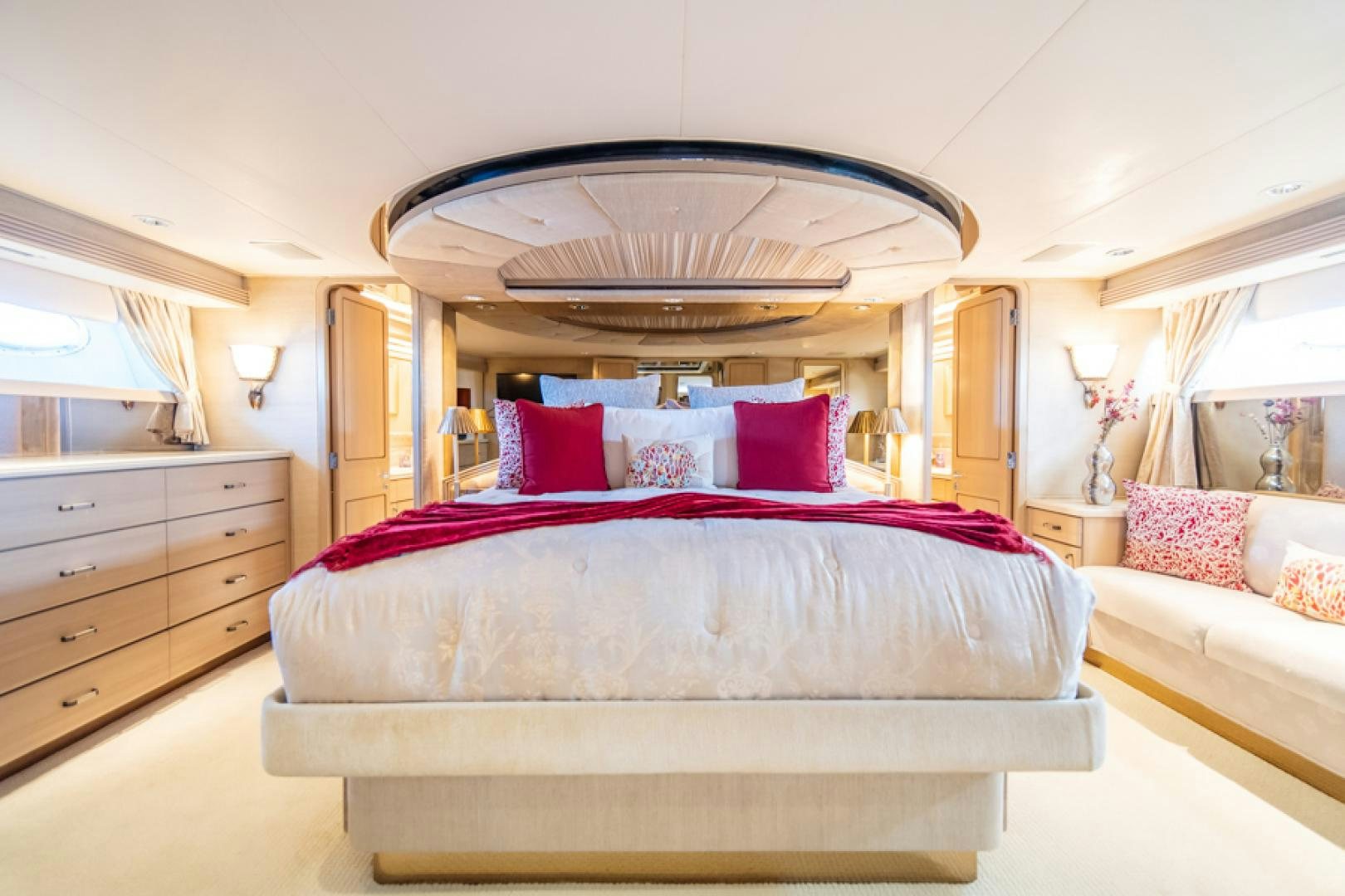 a bedroom with a large mirror aboard NO EXCEPTIONS Yacht for Sale