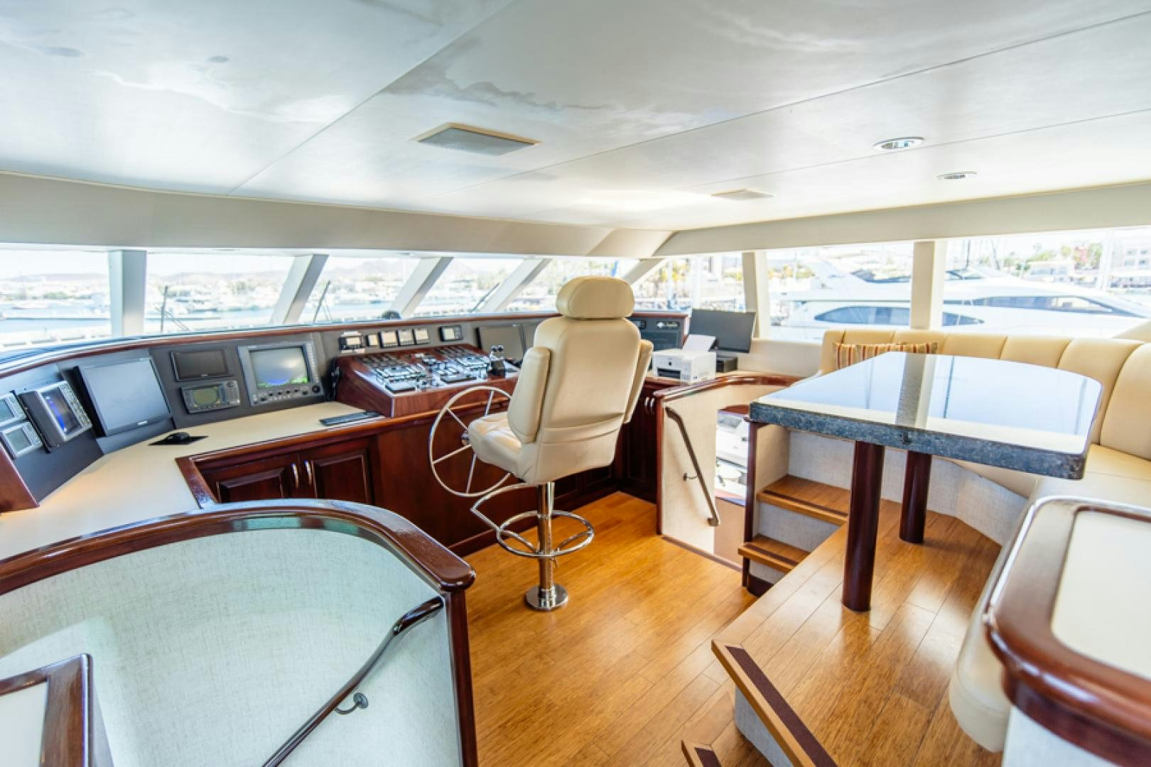 a room with tables and chairs aboard NO EXCEPTIONS Yacht for Sale