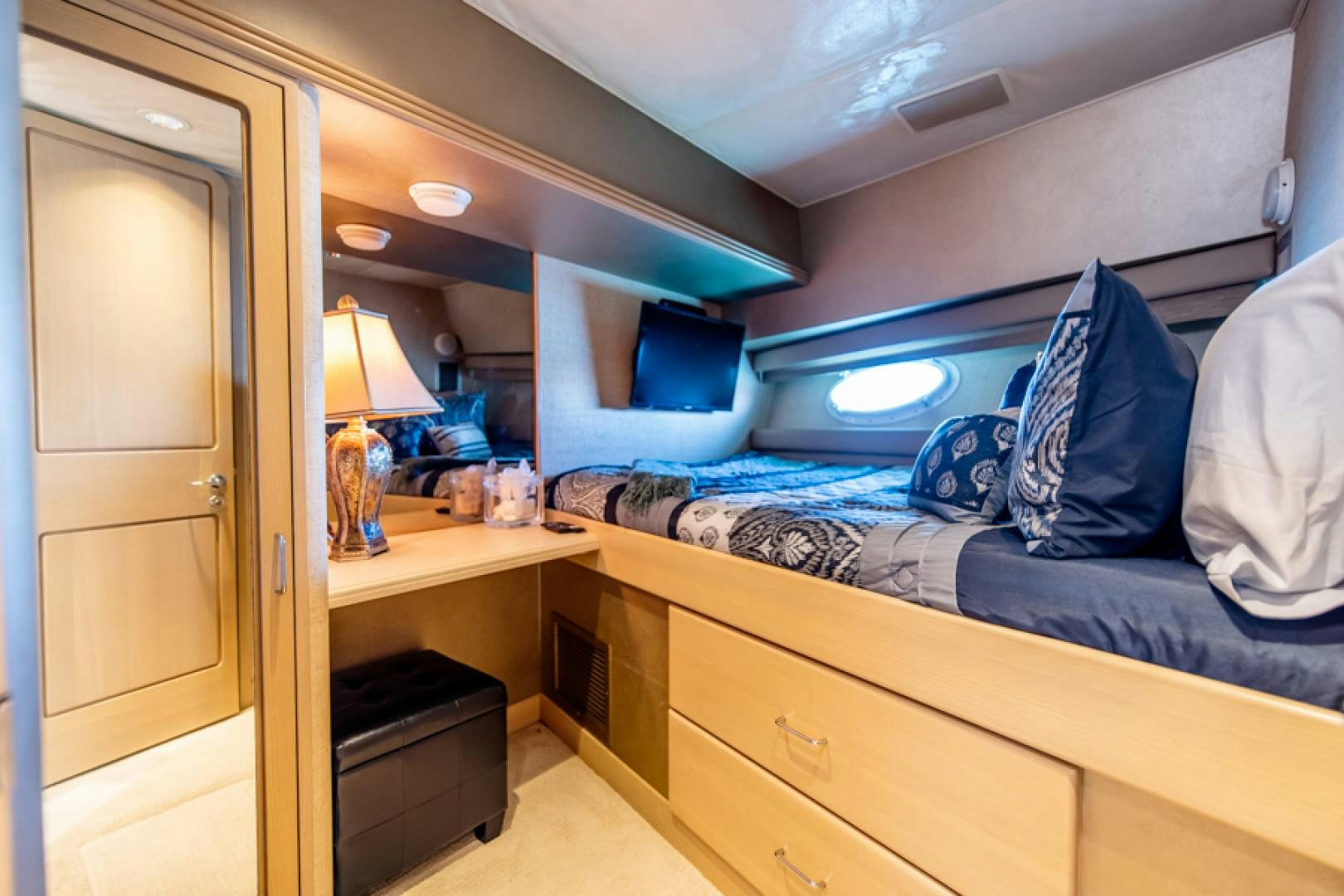 a room with a bed and a desk aboard NO EXCEPTIONS Yacht for Sale