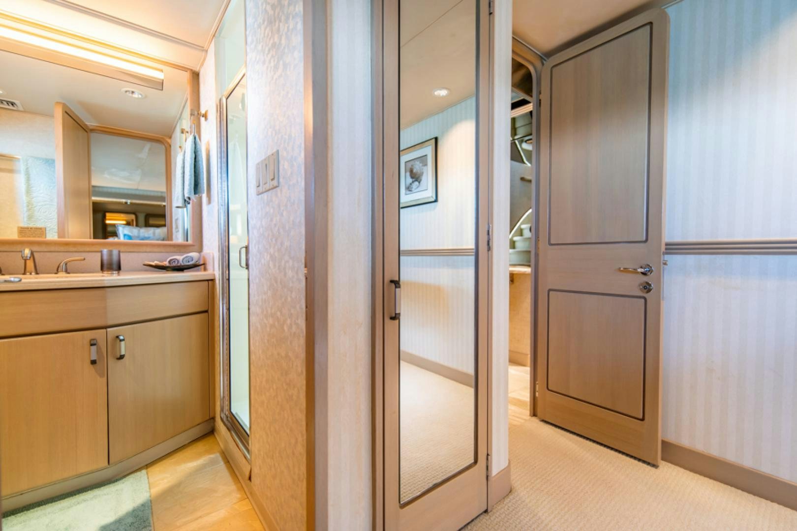 a bathroom with a large mirror aboard NO EXCEPTIONS Yacht for Sale