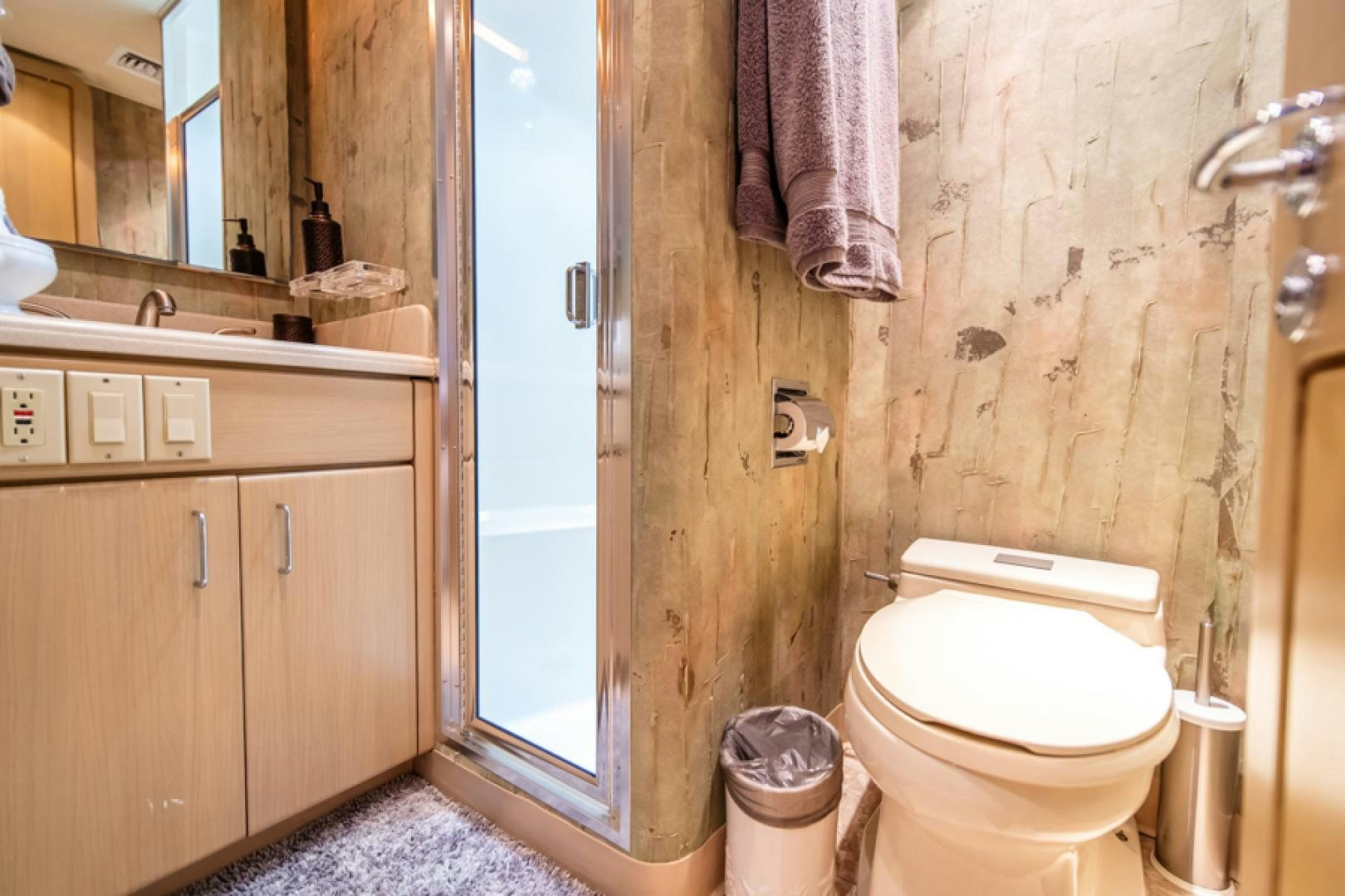 a bathroom with a toilet and a sink aboard NO EXCEPTIONS Yacht for Sale