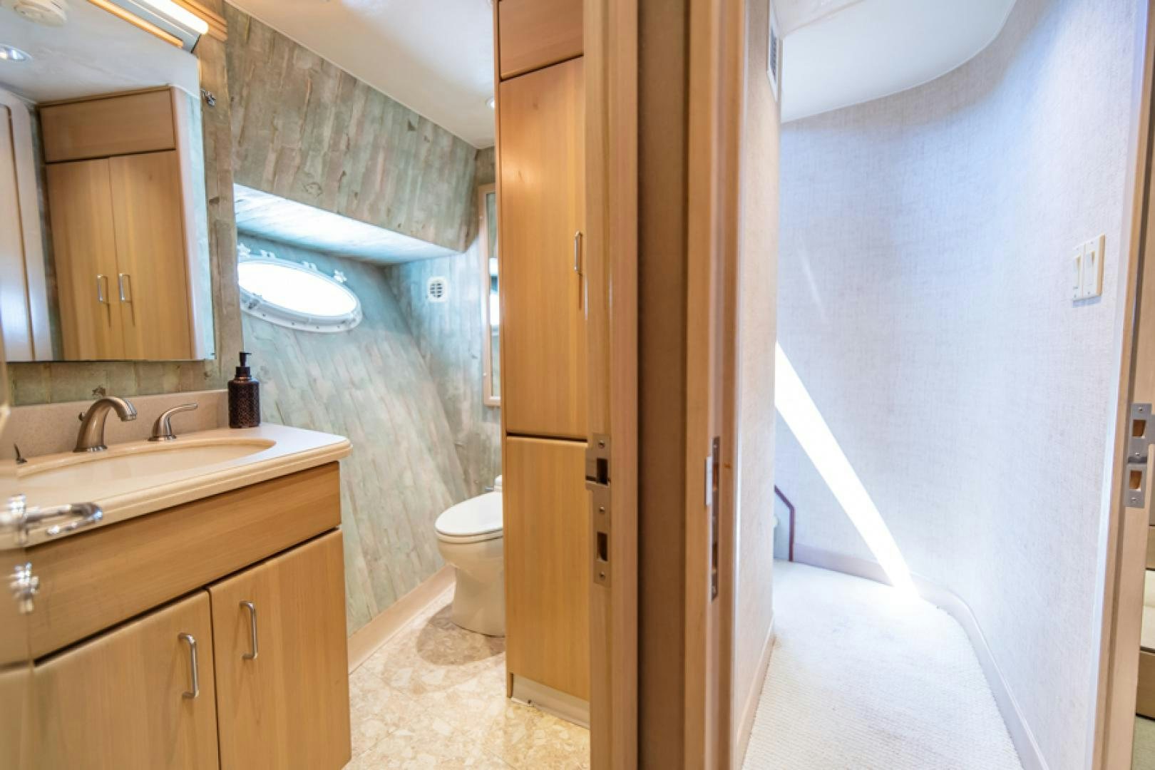 a bathroom with a tub sink and toilet aboard NO EXCEPTIONS Yacht for Sale