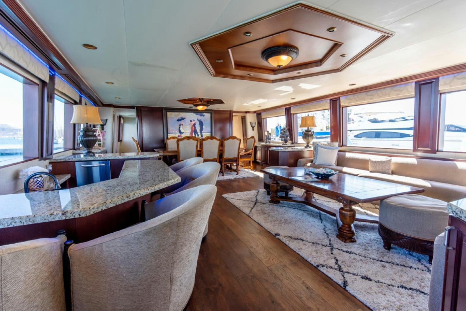 a living room with a large table aboard NO EXCEPTIONS Yacht for Sale