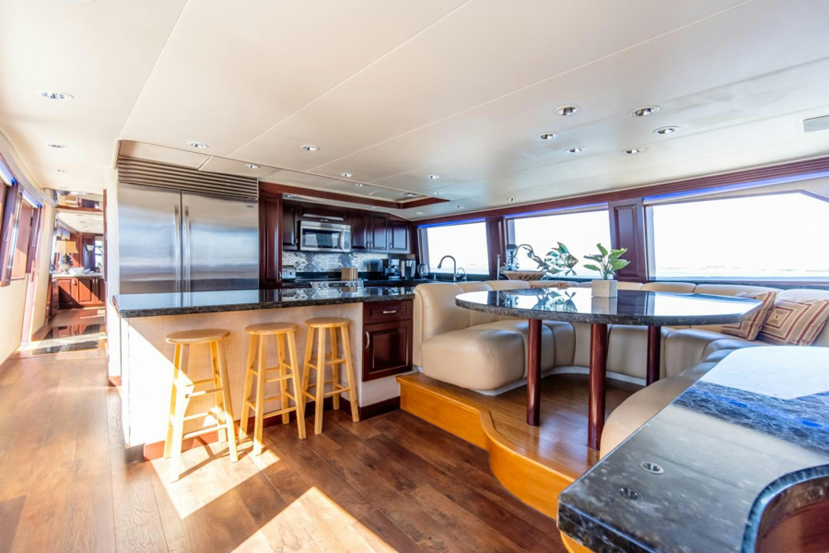 a kitchen with a table and chairs aboard NO EXCEPTIONS Yacht for Sale