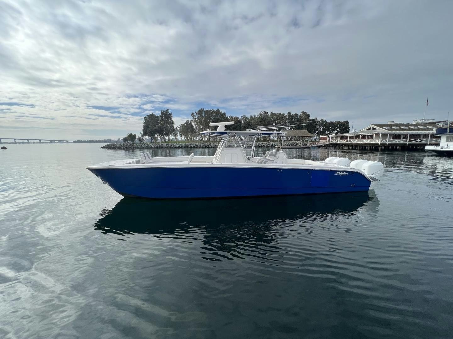 a large blue boat in the water aboard 8 PACK Yacht for Sale