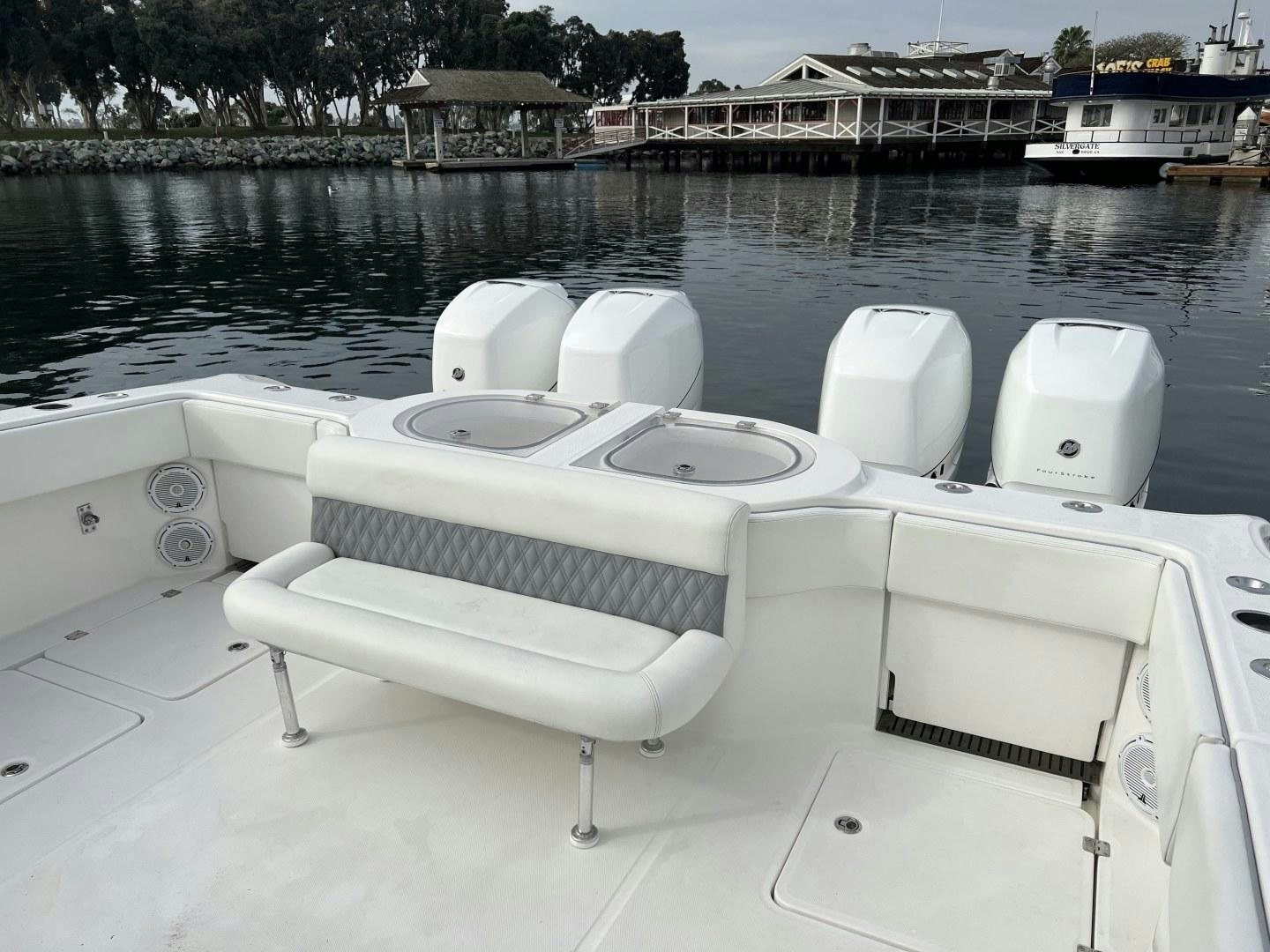 a row of white boats on a lake aboard 8 PACK Yacht for Sale