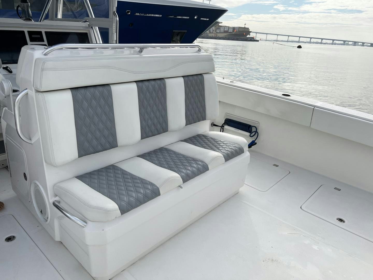 a white chair on a boat aboard 8 PACK Yacht for Sale