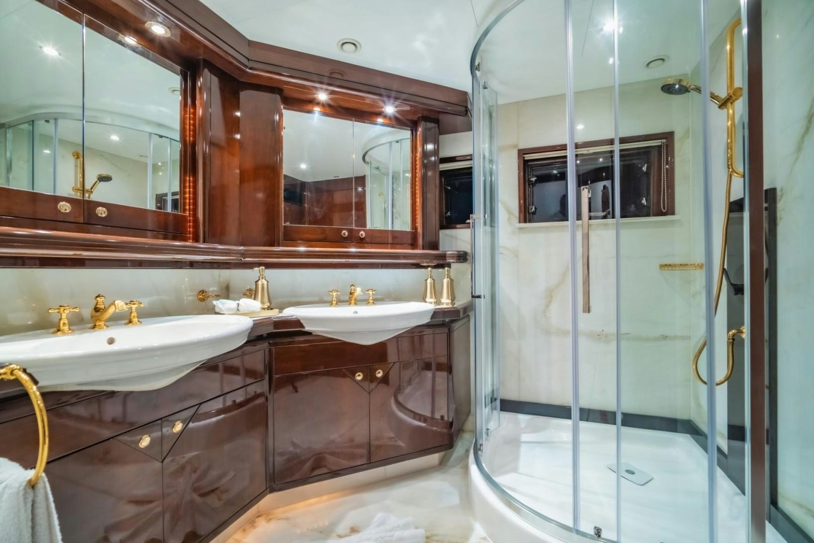 a bathroom with a large mirror aboard XANADU OF LONDON Yacht for Sale