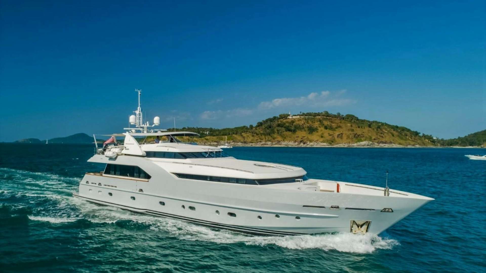 a white yacht on the water aboard Xanadu Yacht for Sale