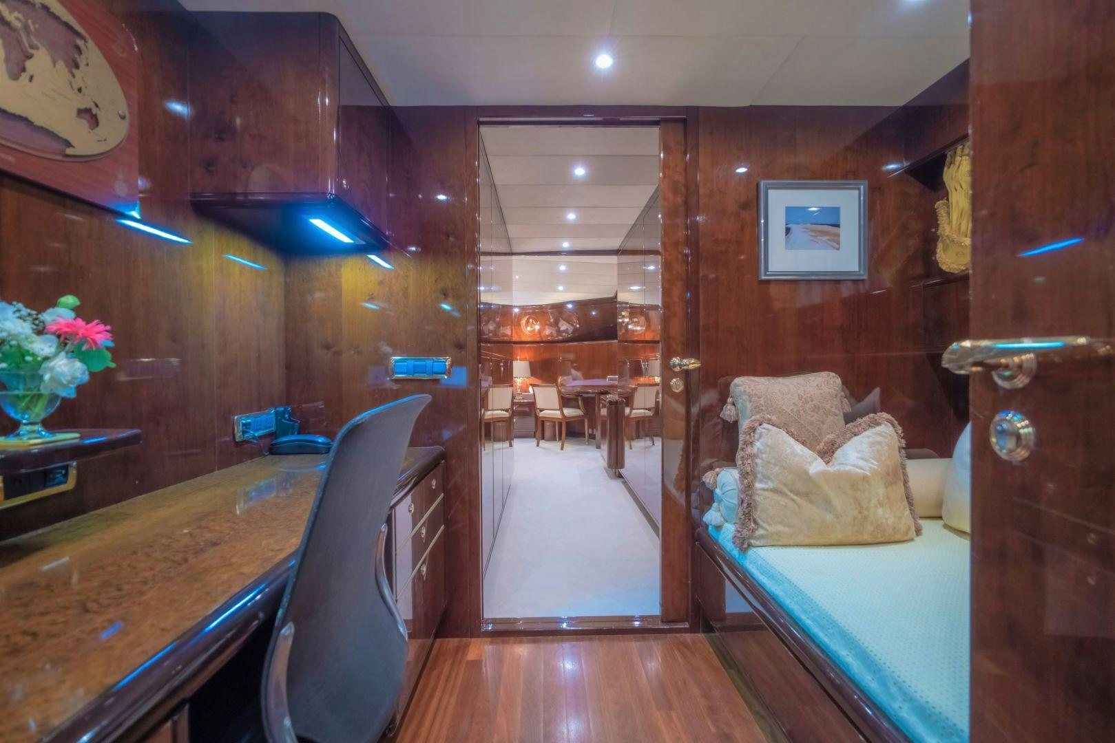 a room with a table chairs and a couch aboard XANADU OF LONDON Yacht for Sale
