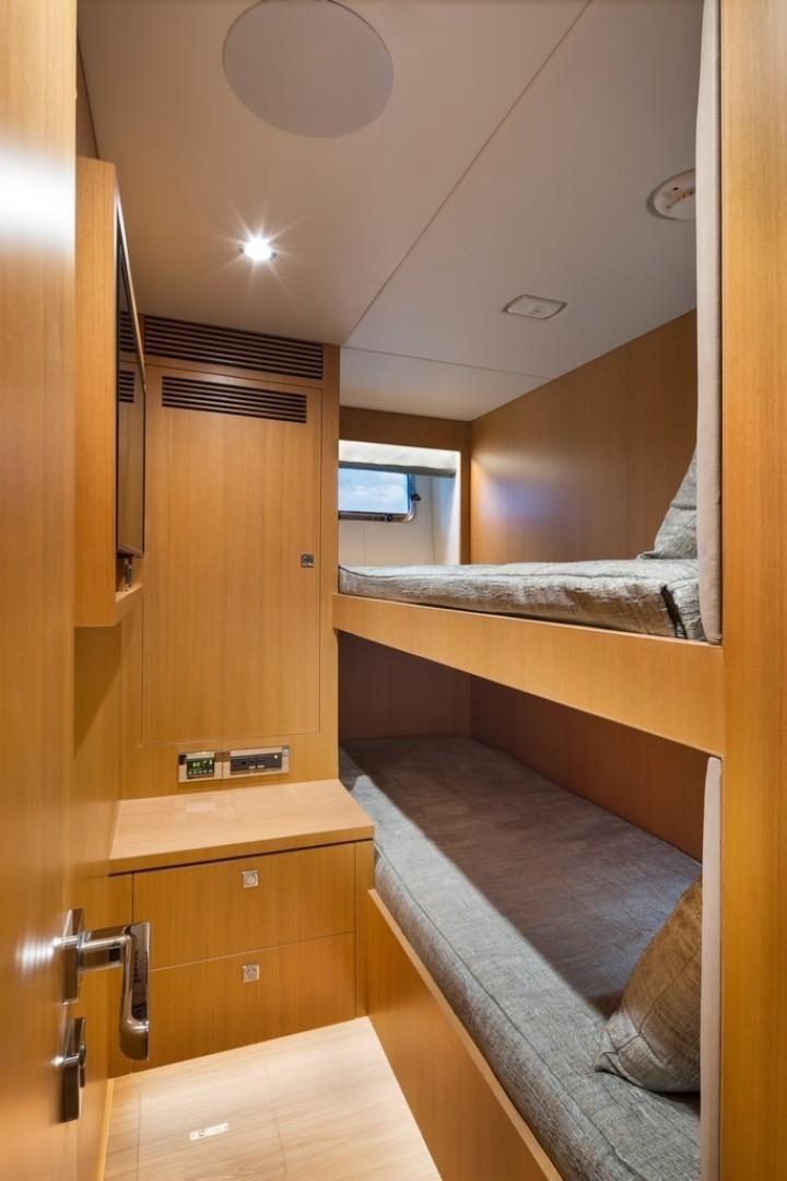 a room with a bed and a window aboard PARABOLIC Yacht for Sale