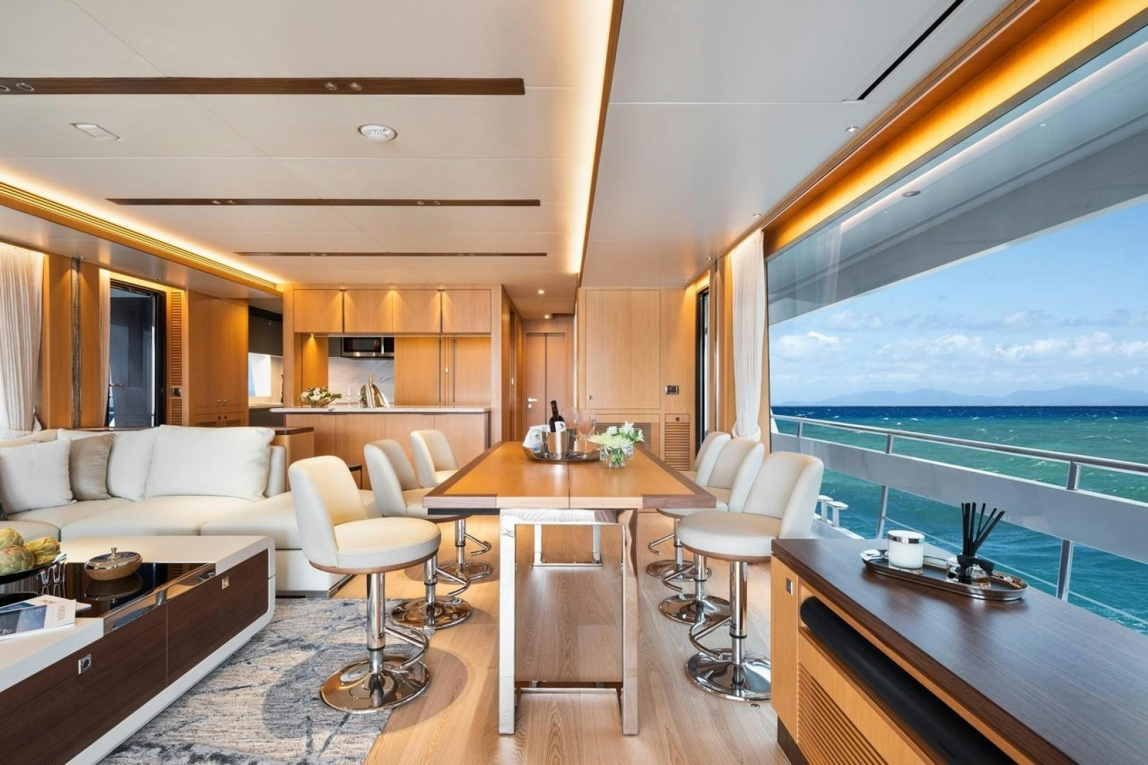 a living room with a large window aboard PARABOLIC Yacht for Sale