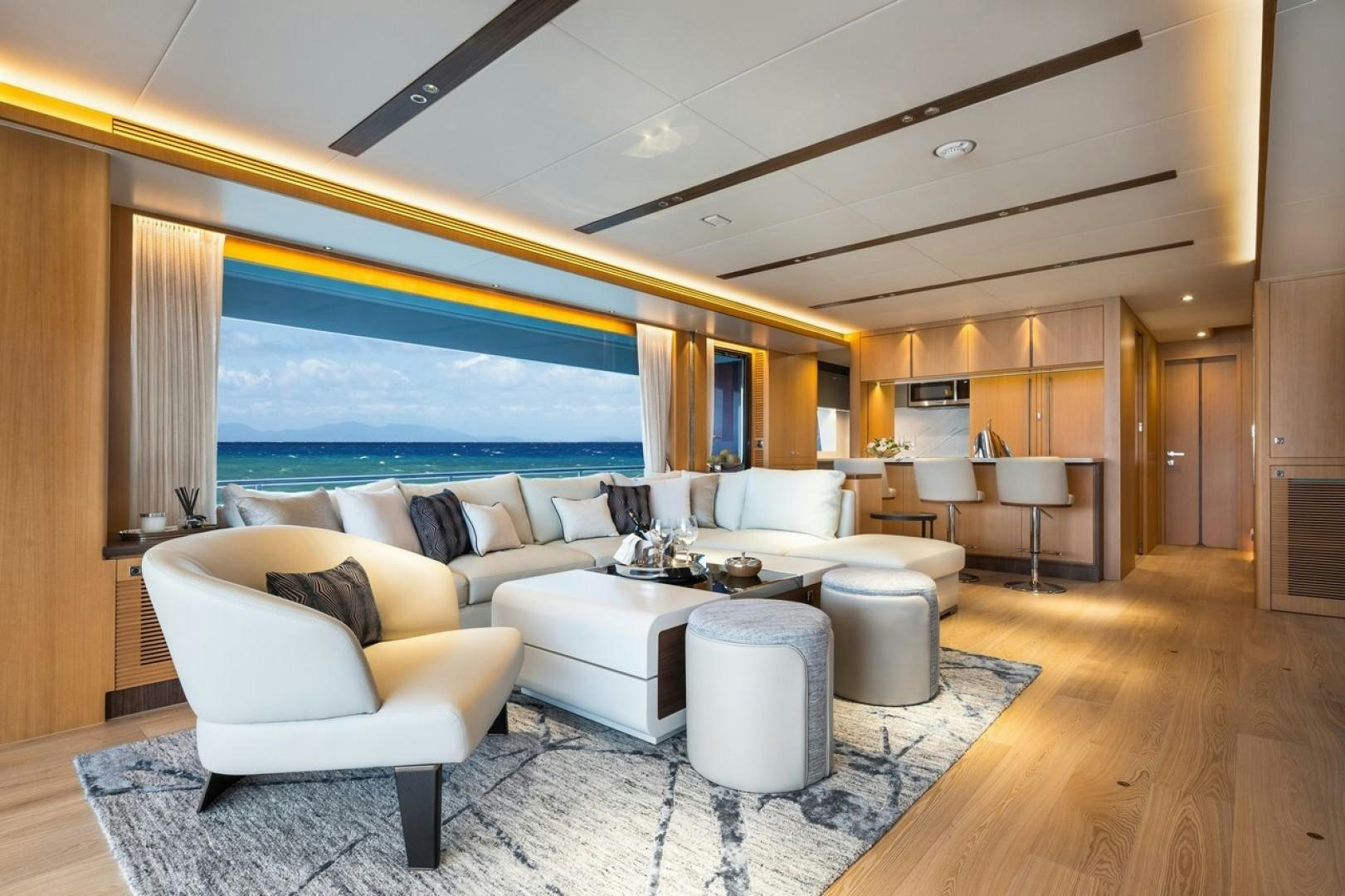 a living room with a large window aboard PARABOLIC Yacht for Sale