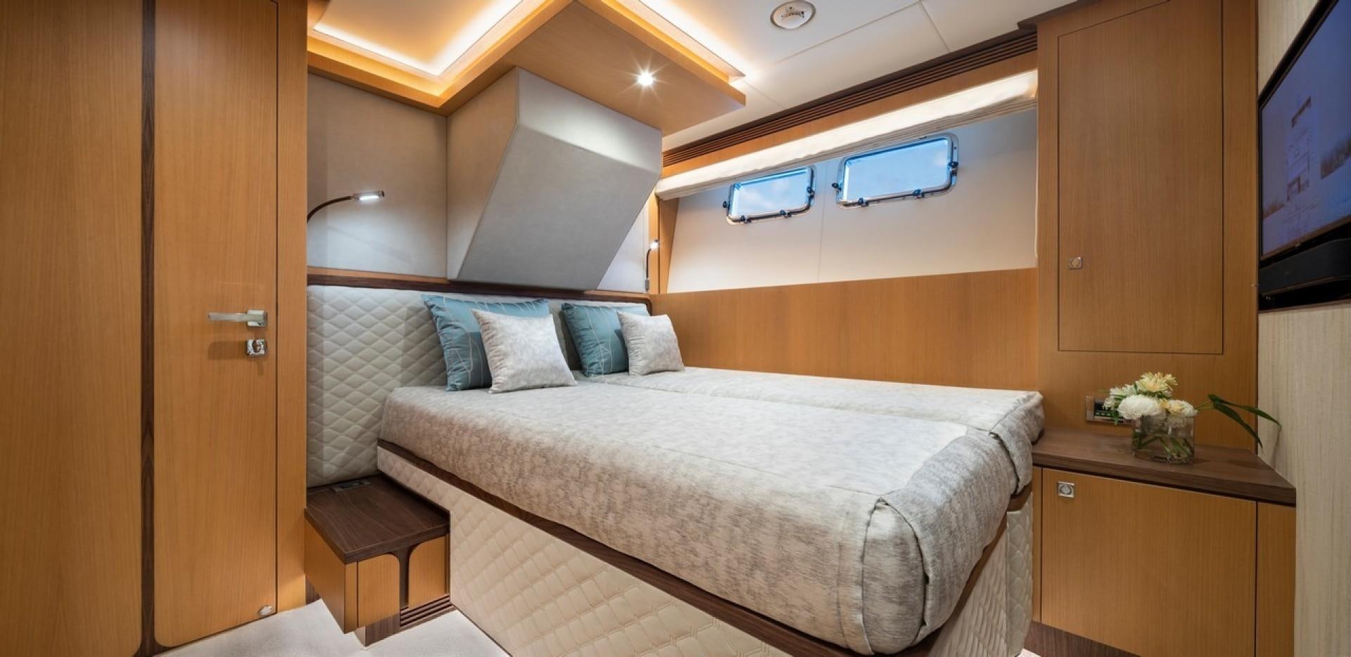 a bed in a room aboard PARABOLIC Yacht for Sale