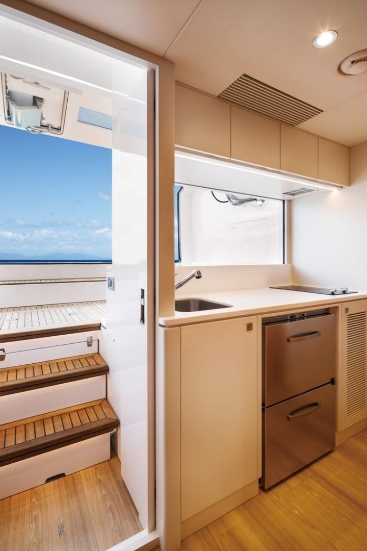 a kitchen with a large window aboard PARABOLIC Yacht for Sale
